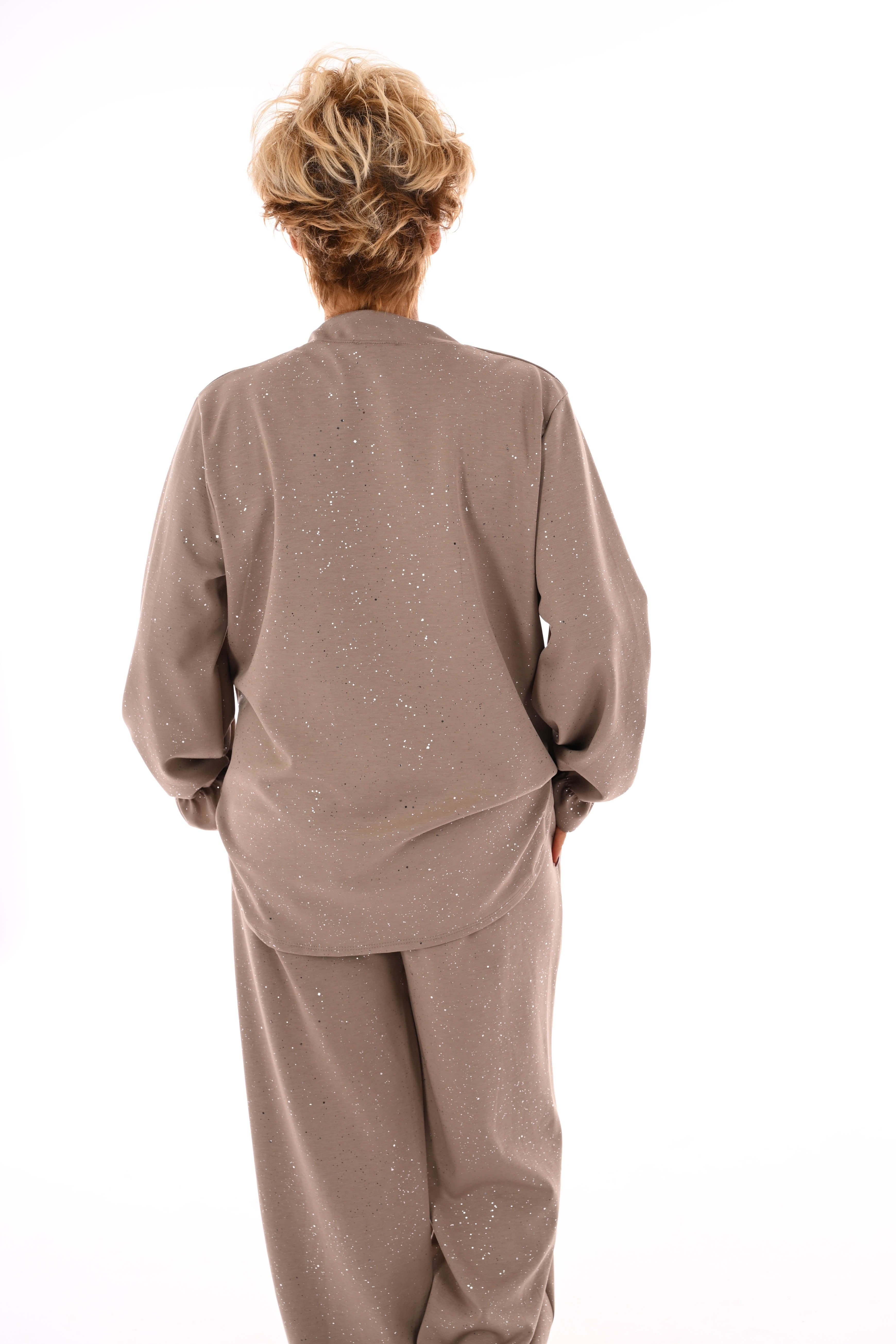 Tweedelig pak glitter flakes roezelmouwen beige