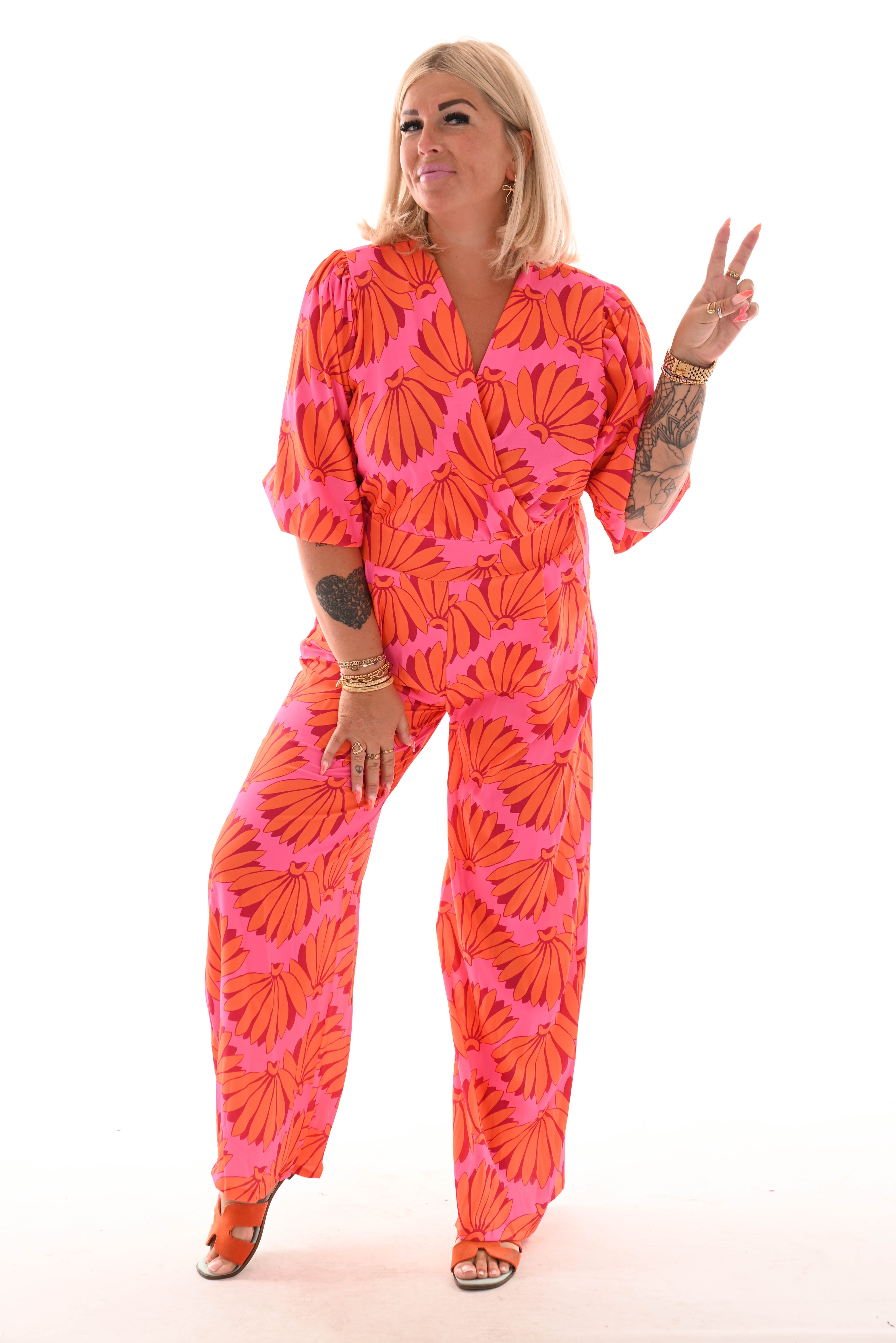 Jumpsuit overslag print bloemen roze/oranje