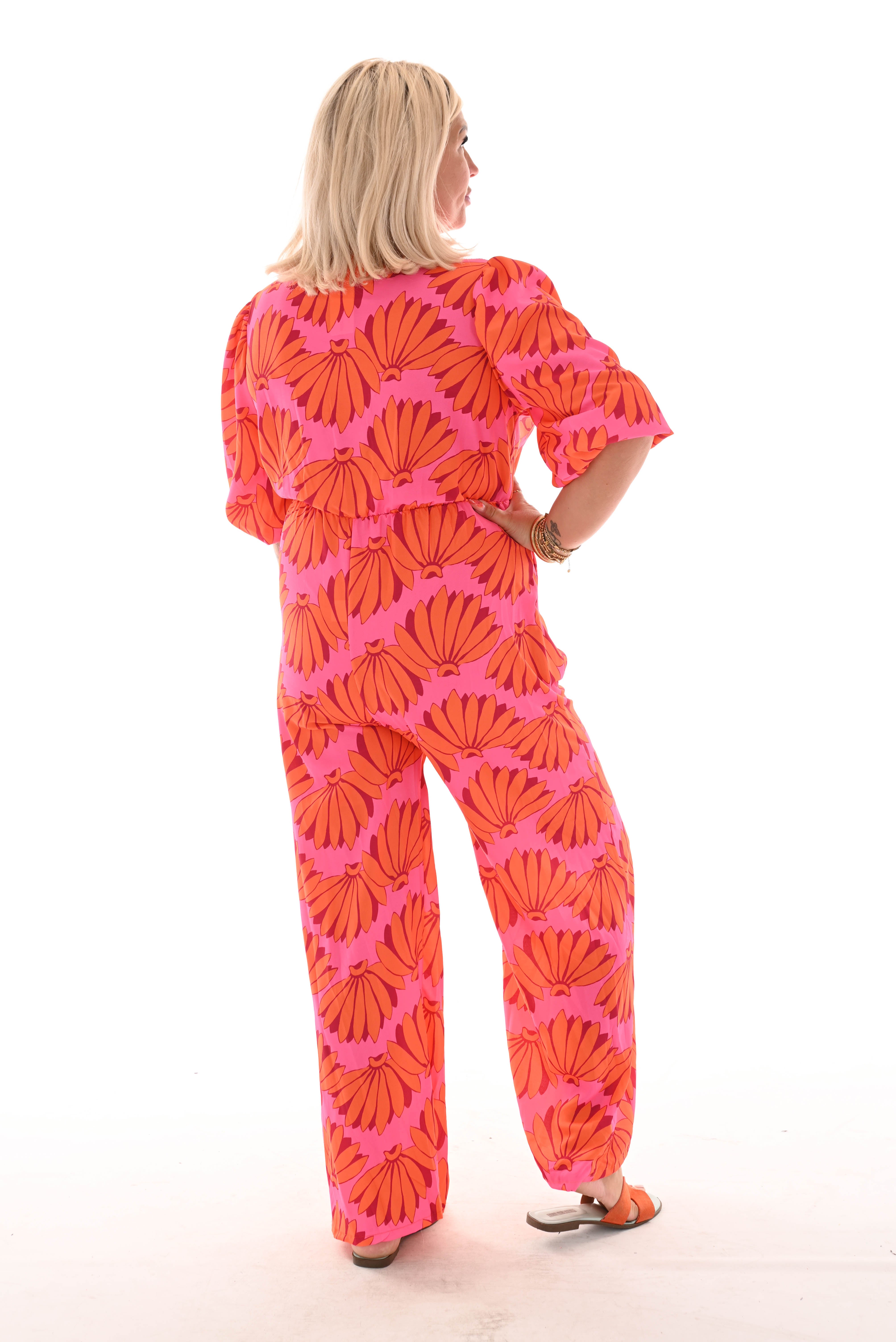 Jumpsuit overslag print bloemen roze/oranje