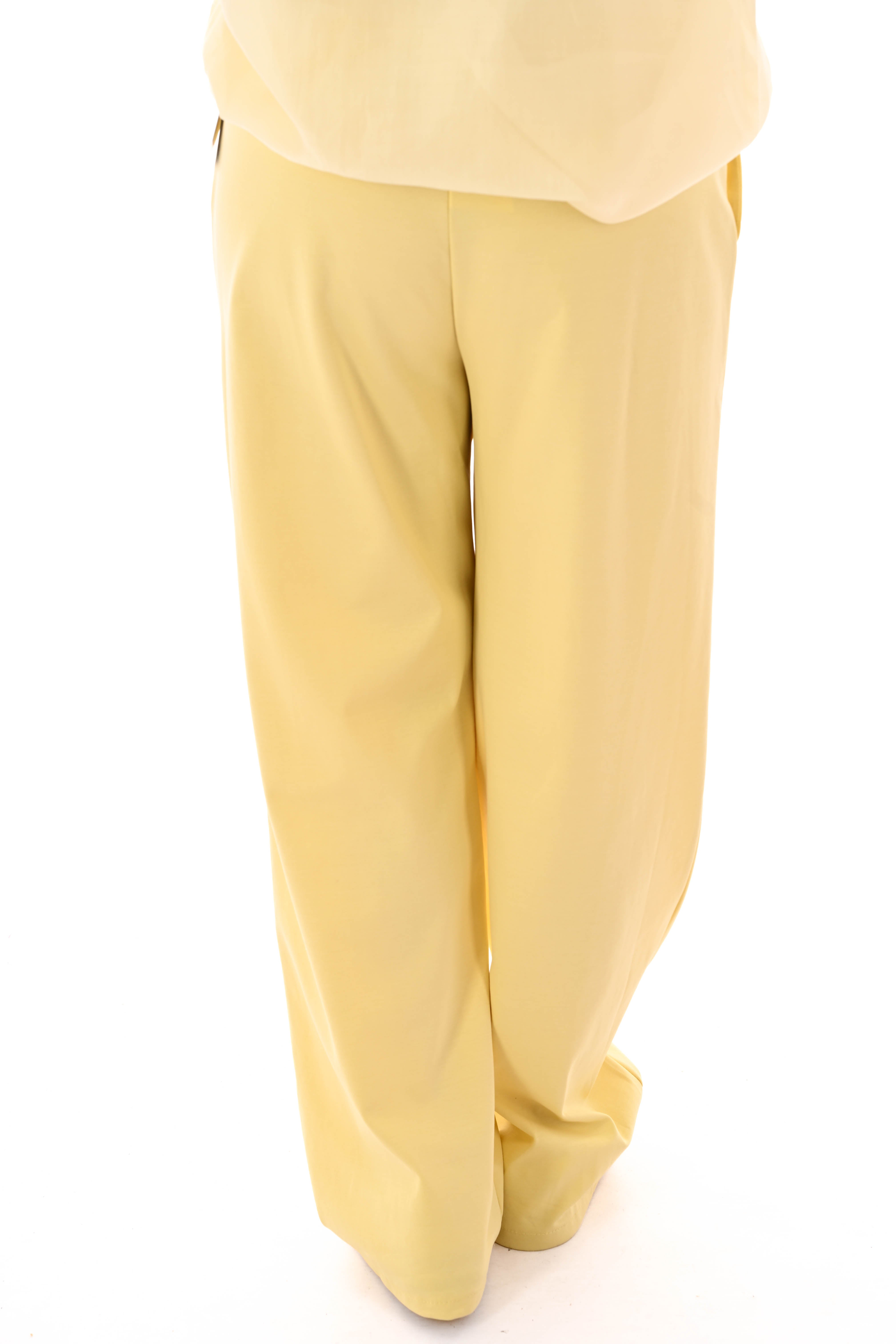 Wijde broek met brede elastieken band botergeel