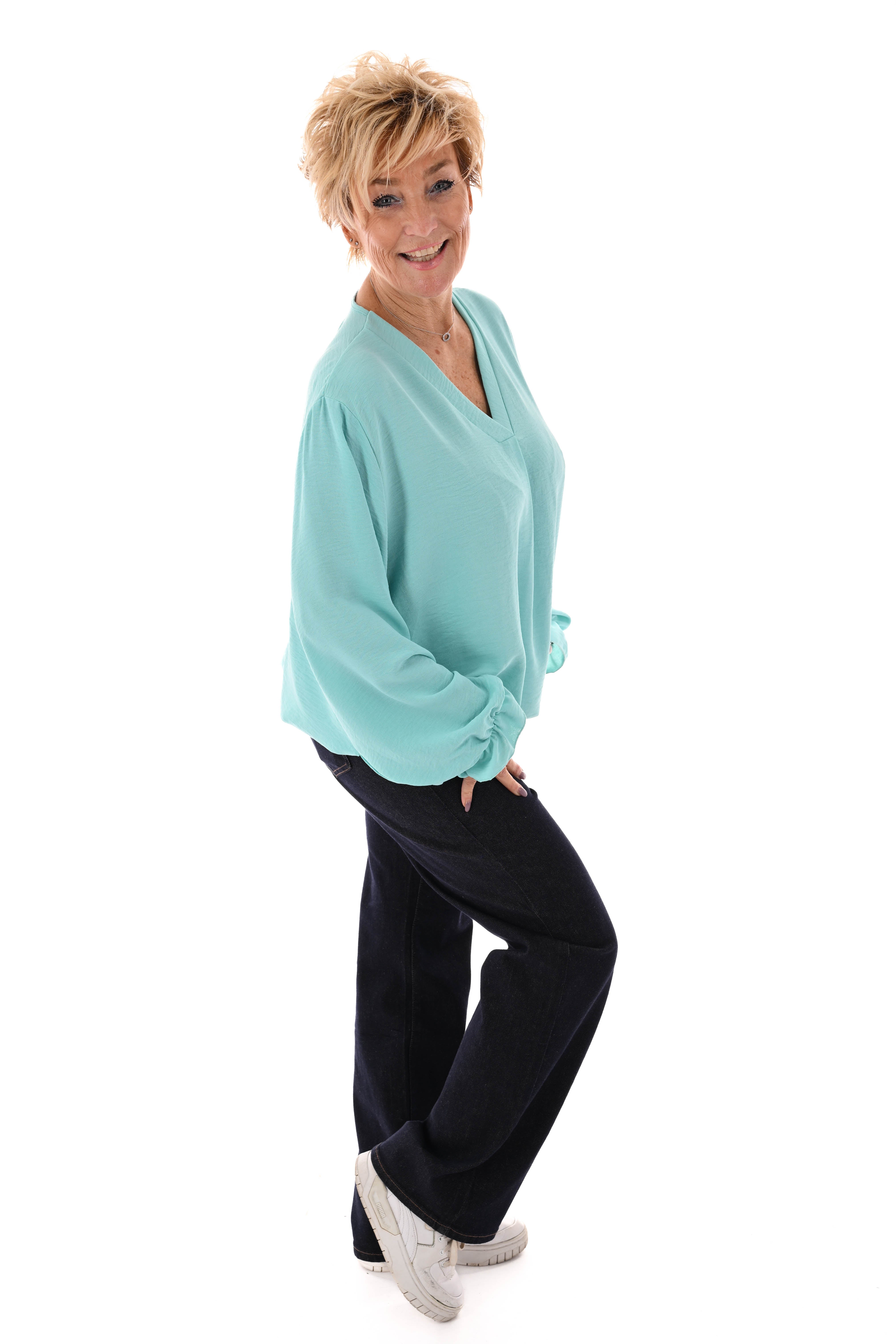 Top trompetmouwen v-hals uni turquoise