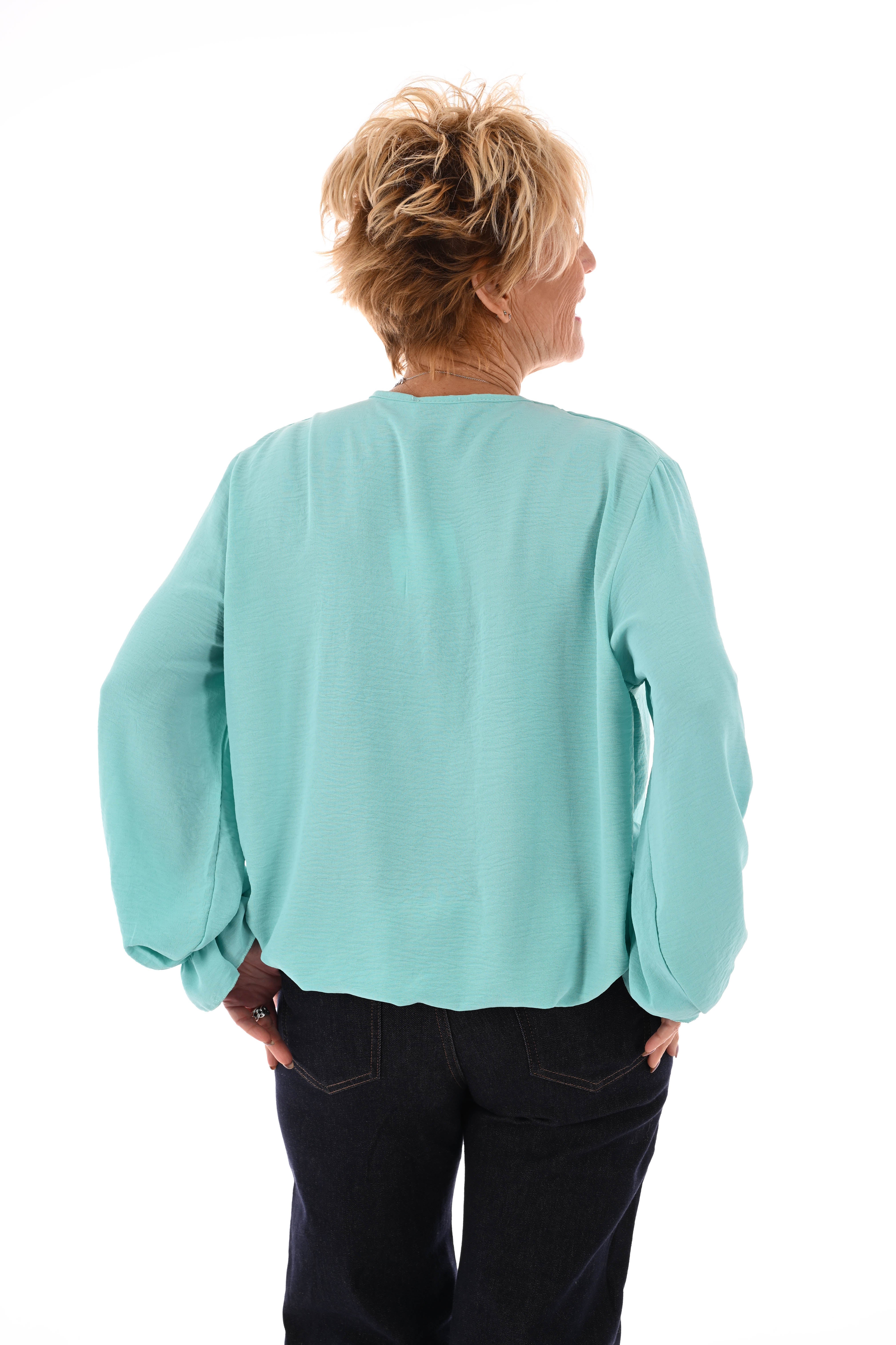 Top trompetmouwen v-hals uni turquoise