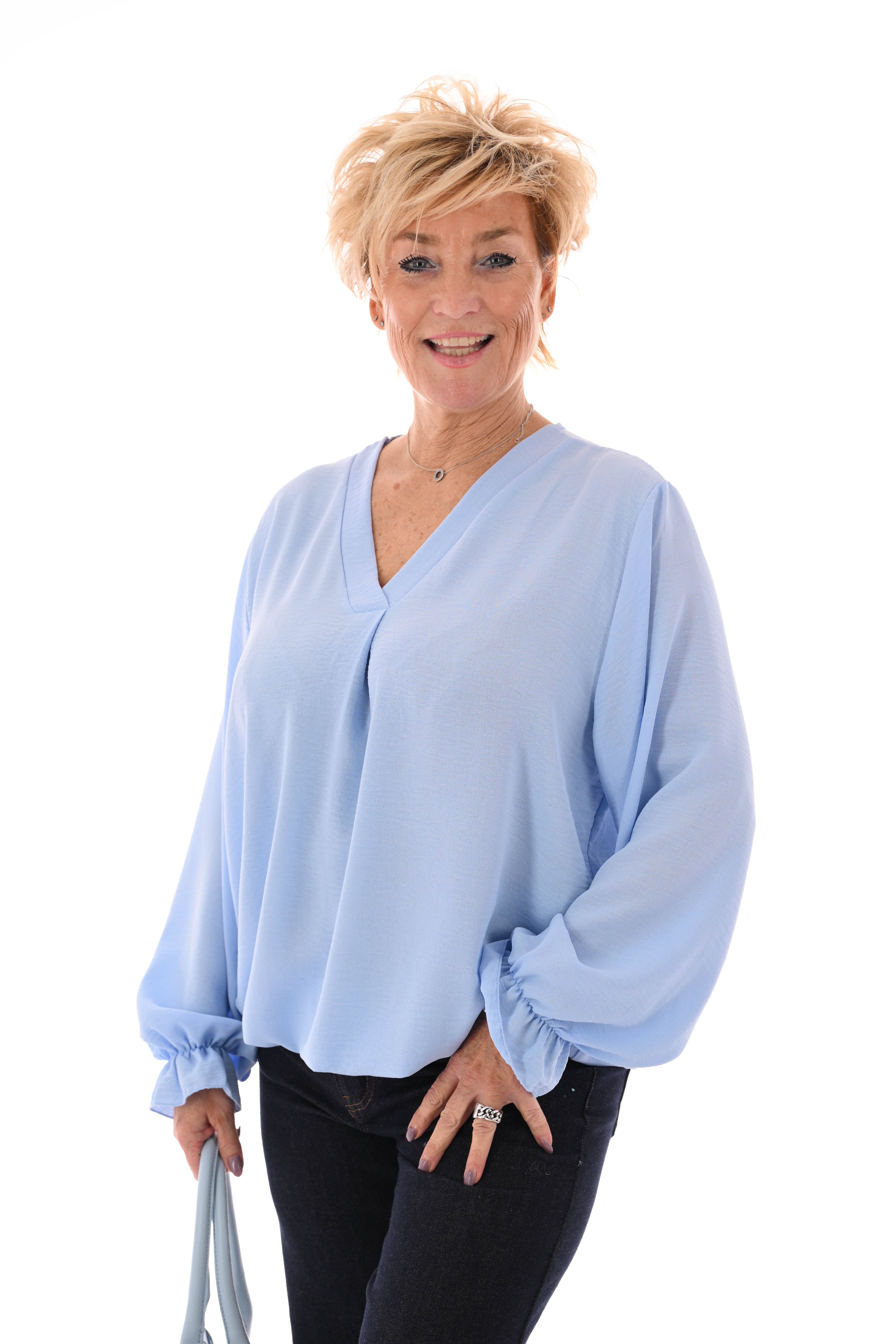 Top trompetmouwen v-hals uni lichtblauw