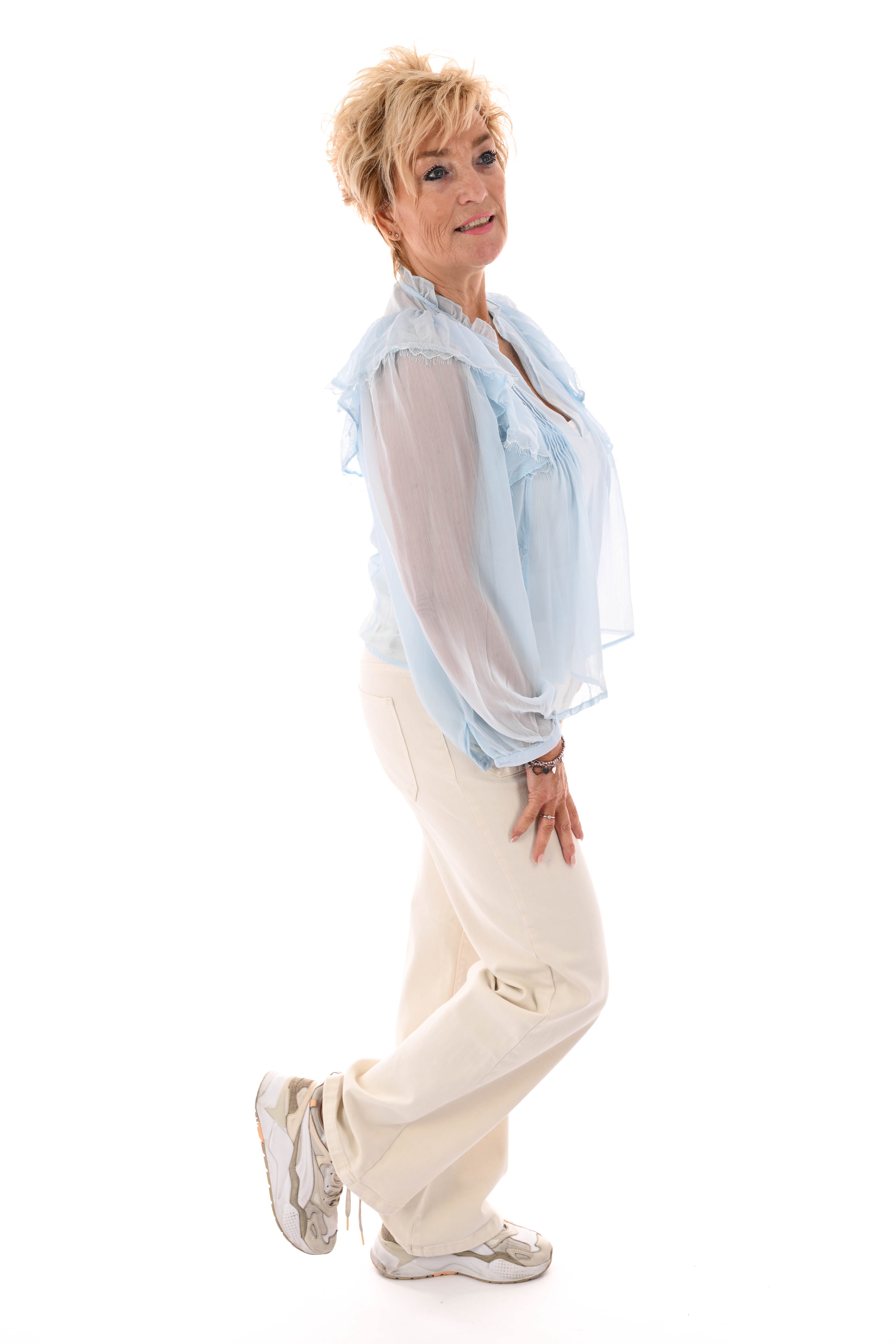 Blouse ruffels lichtblauw