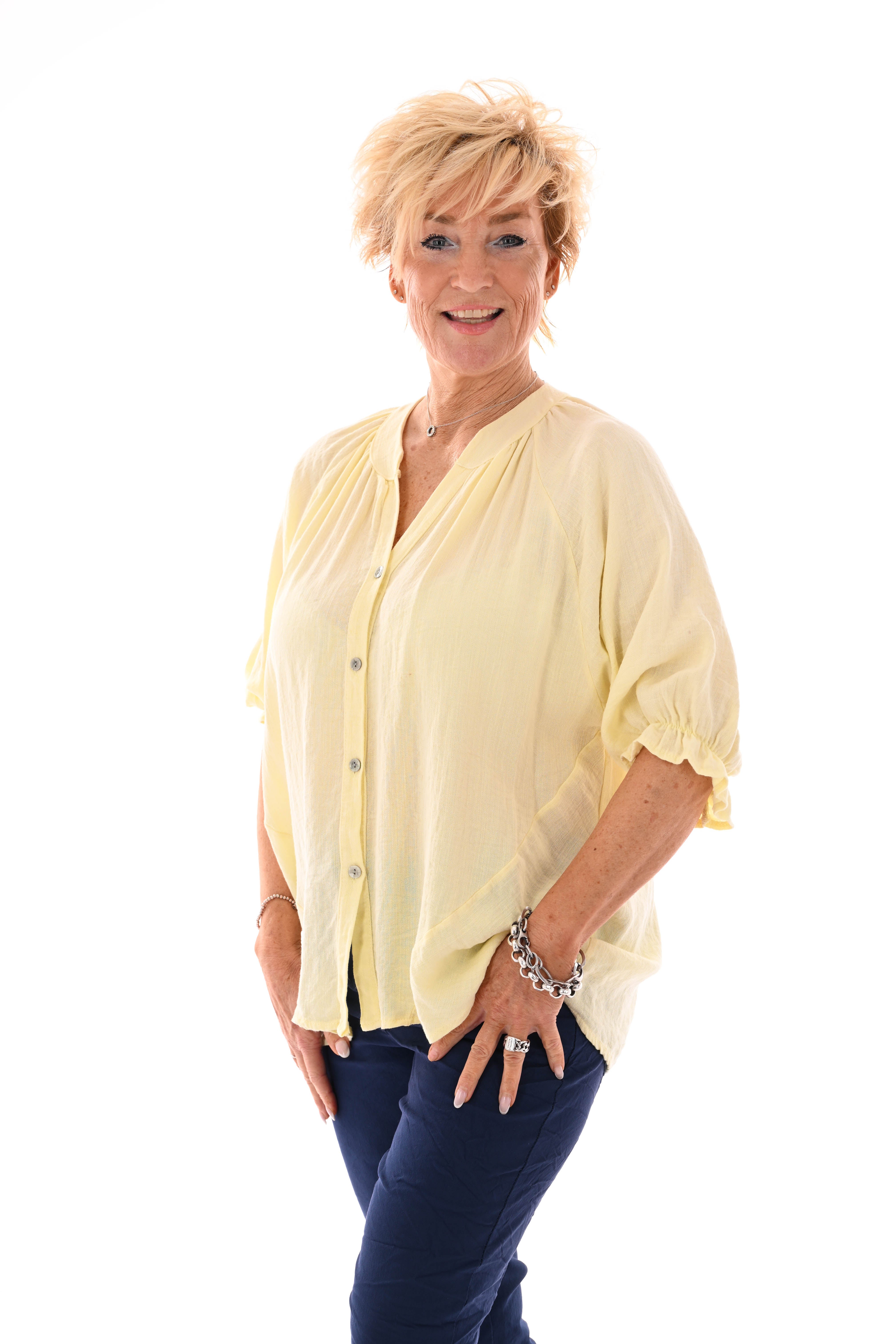 Blouse v-hals korte roezelmouwen lichtgeel