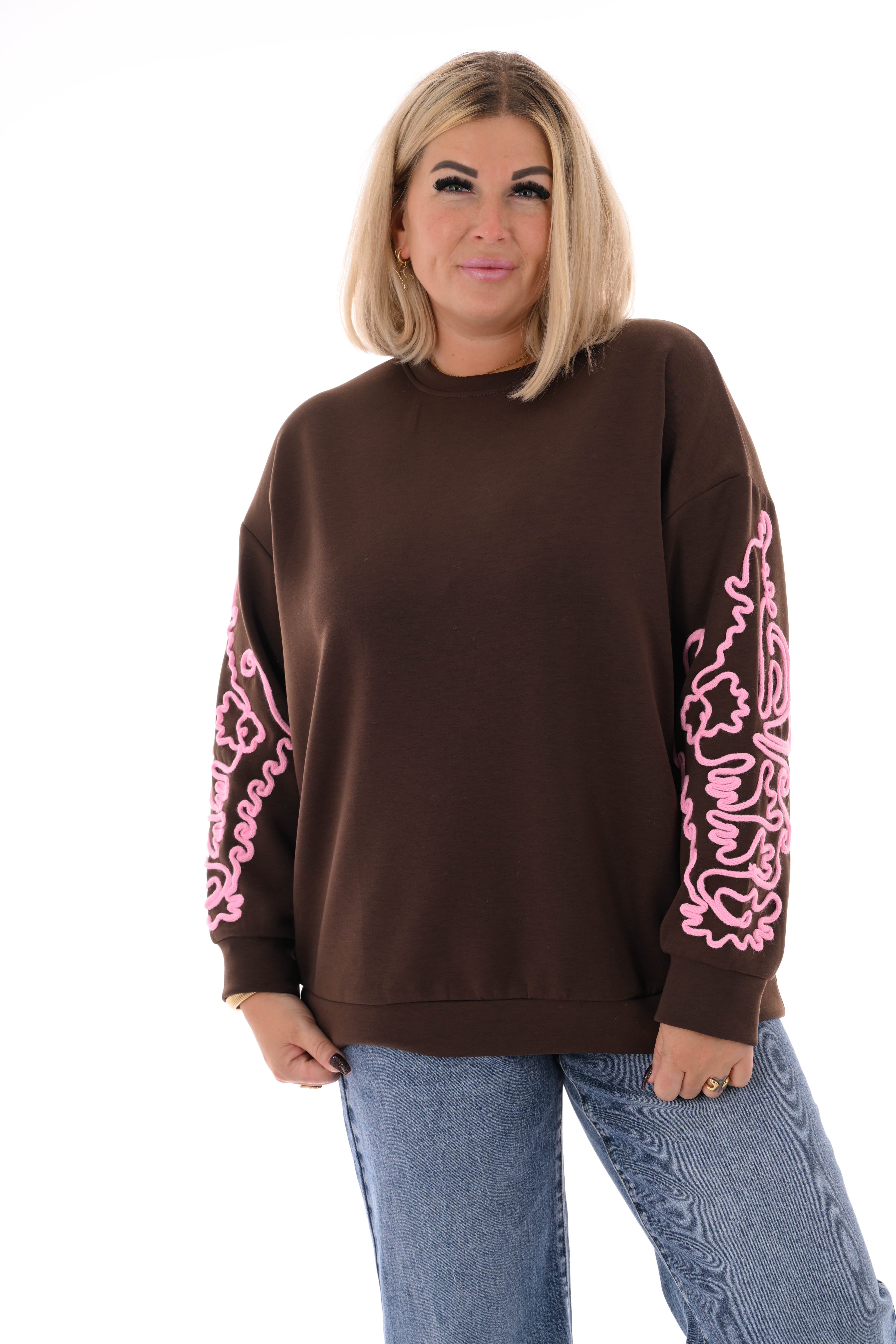Sweater mouwen met borduursels bruin