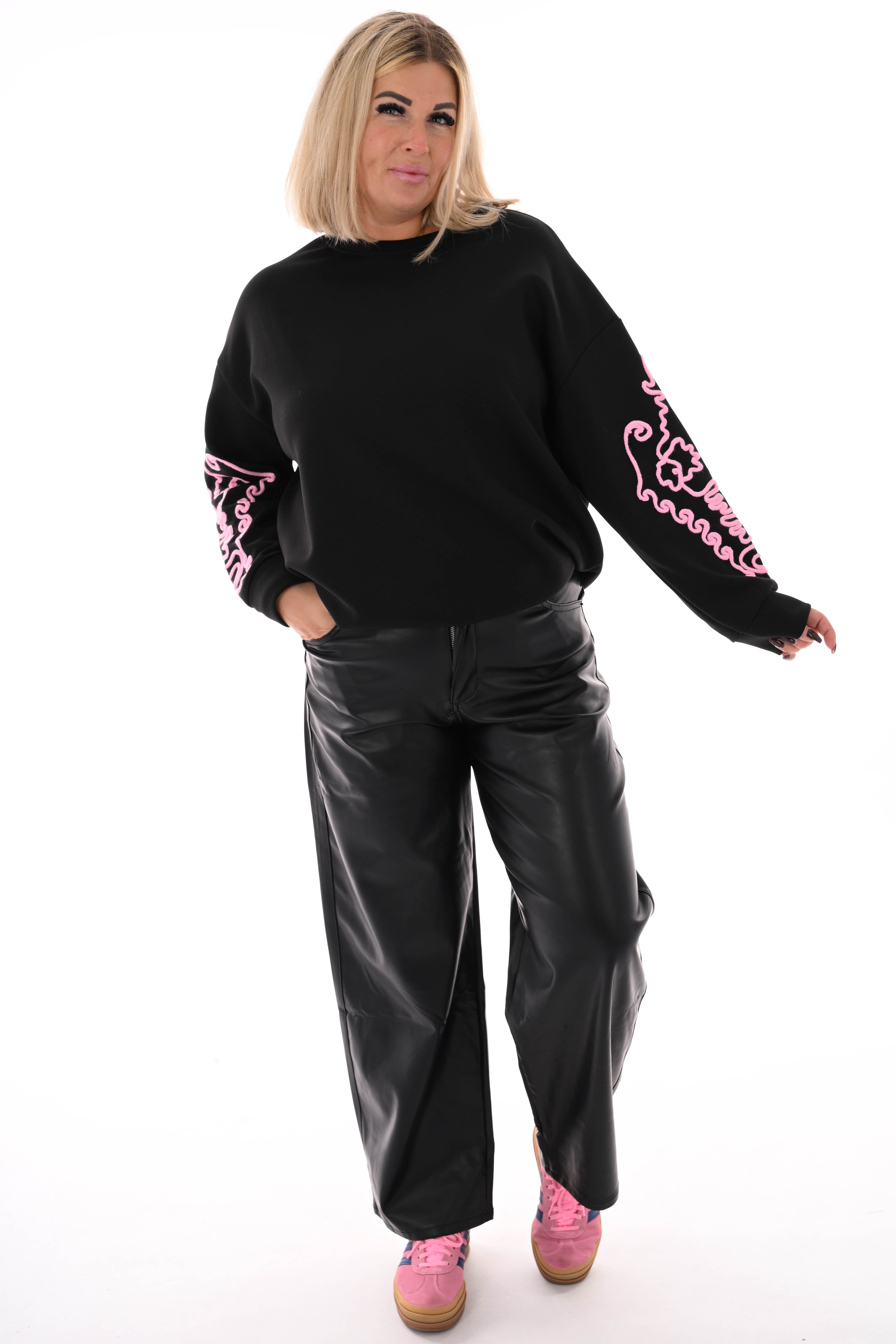 Sweater mouwen met borduursels zwart