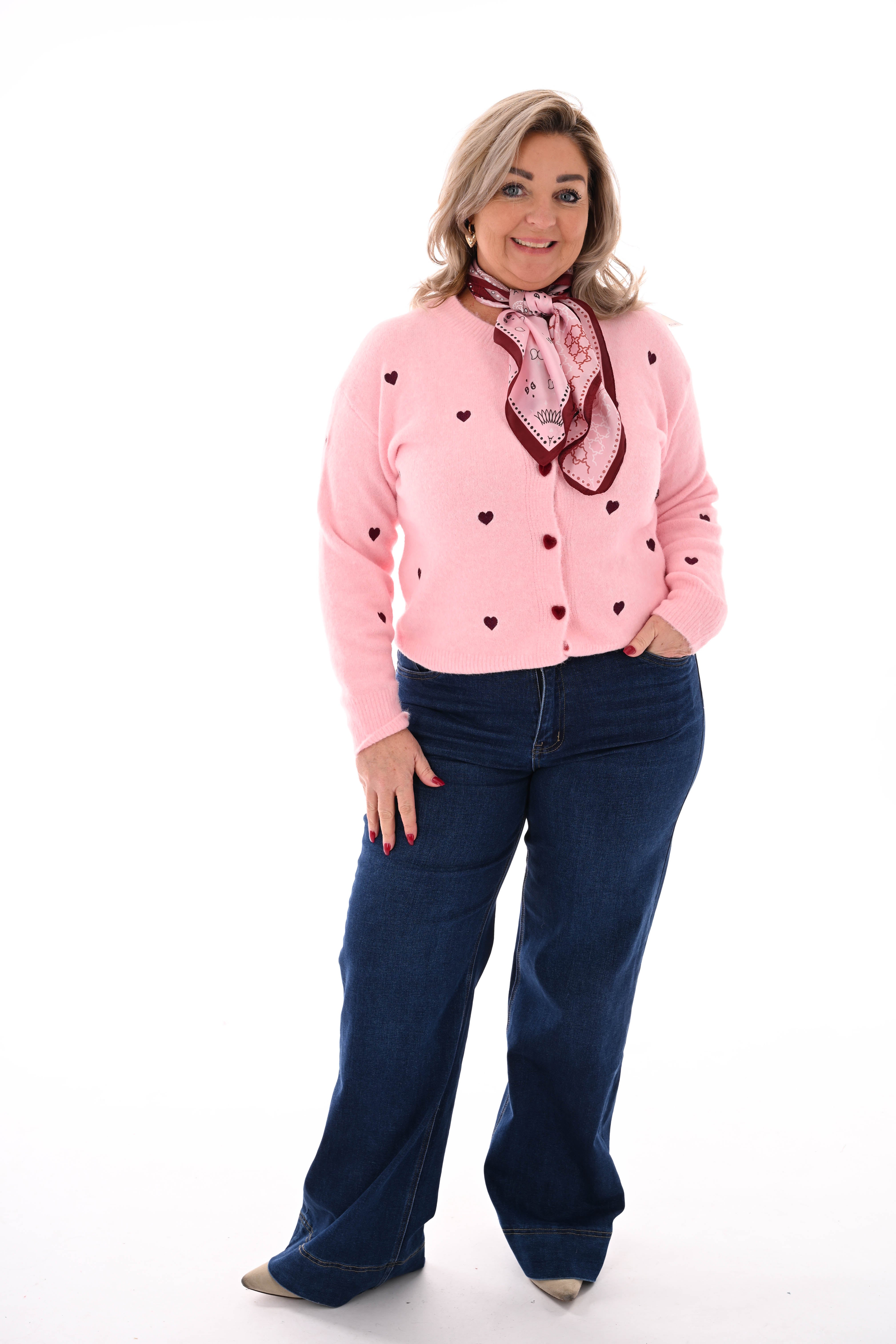 Fijn gebreid vest met hartjes roze