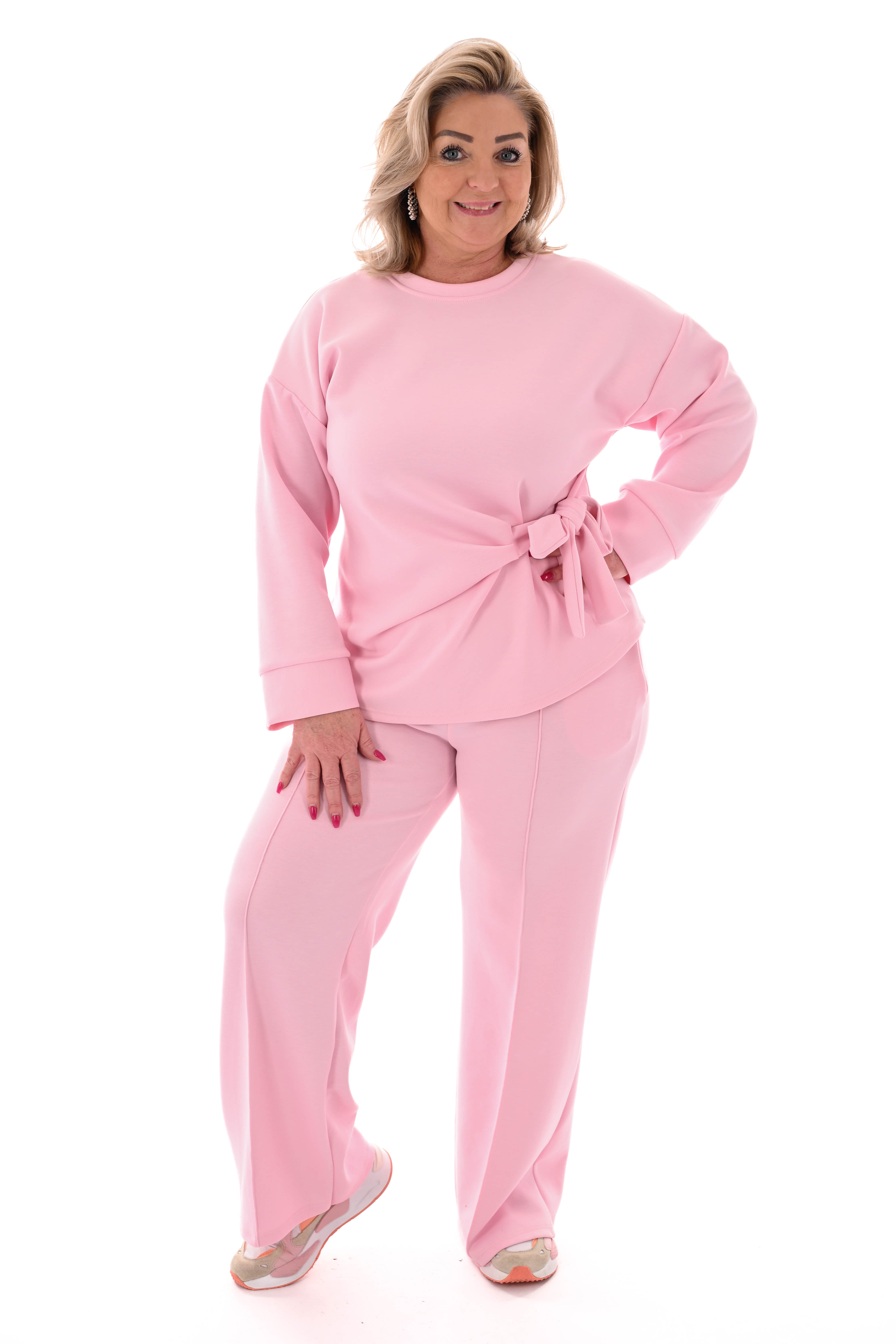 Tweedelig pak knoop detail lichtroze