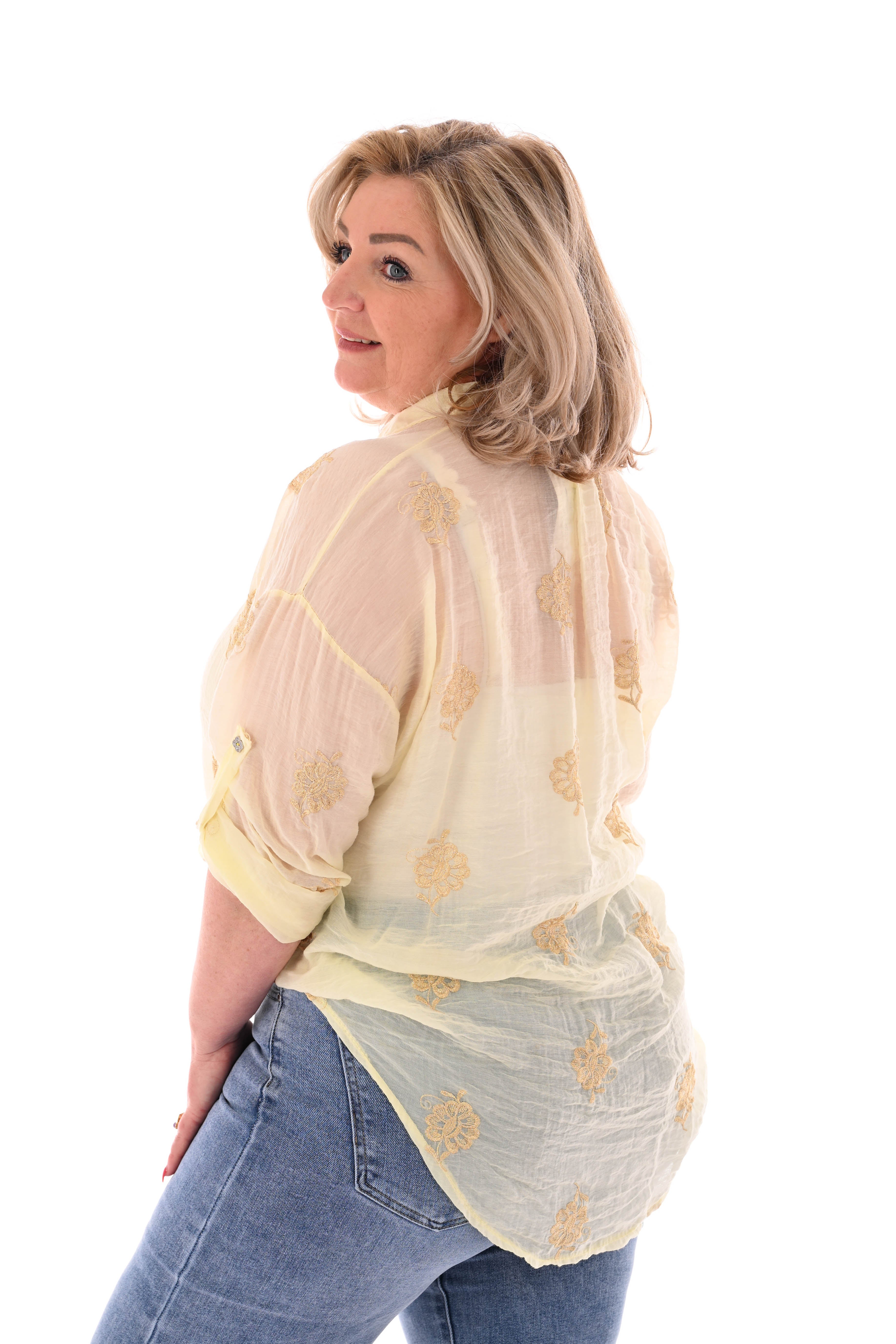 Doorknoop blouse ophaalmouwen borduursels geel