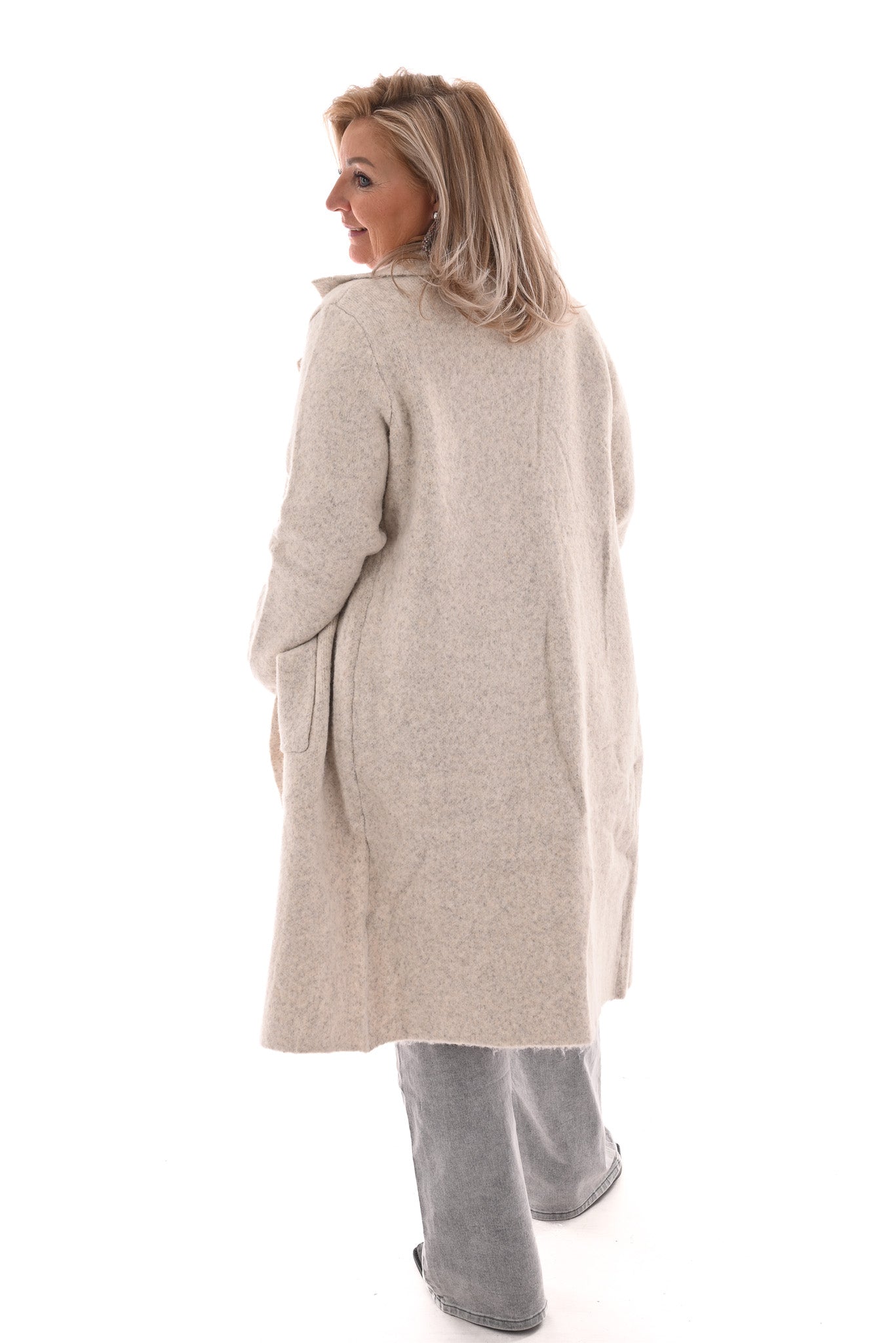 Lang vest met zakken en knoop roomwit
