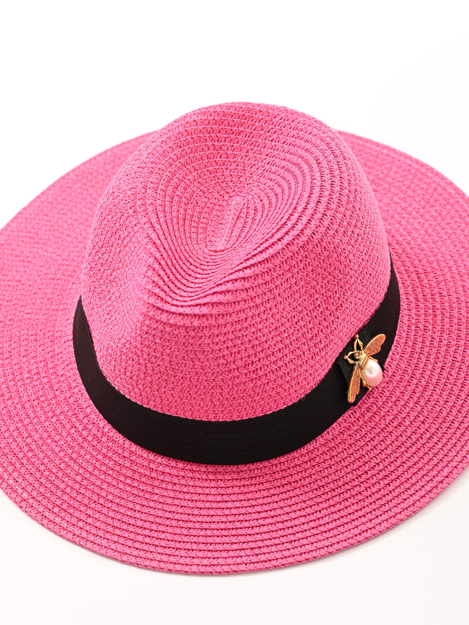 Hoed met bij fuchsia