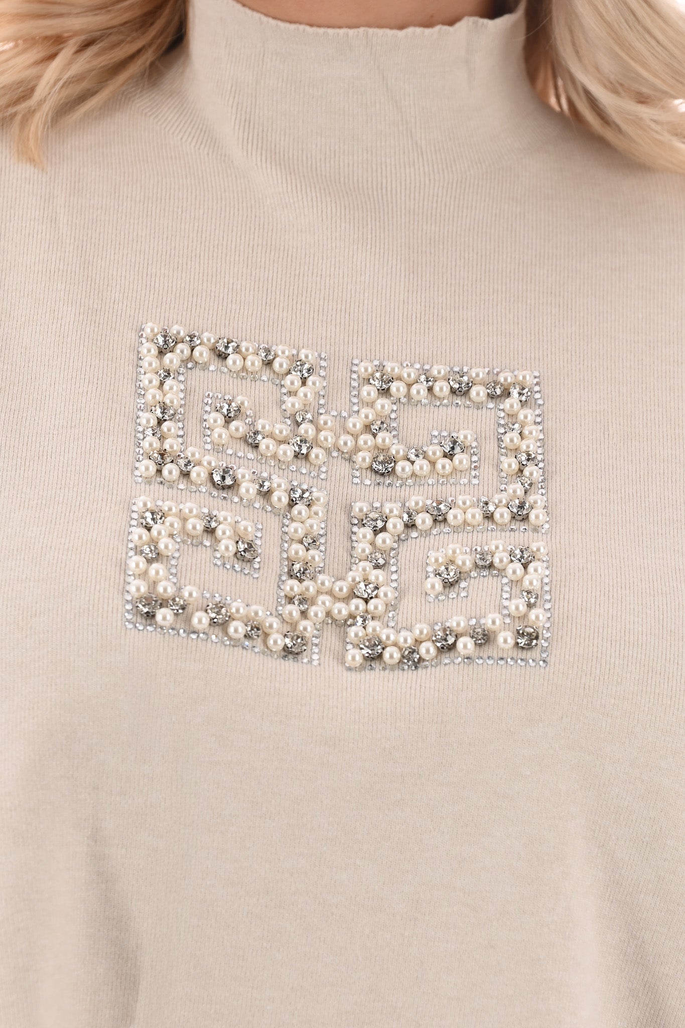 Trui met glitters en parels creme
