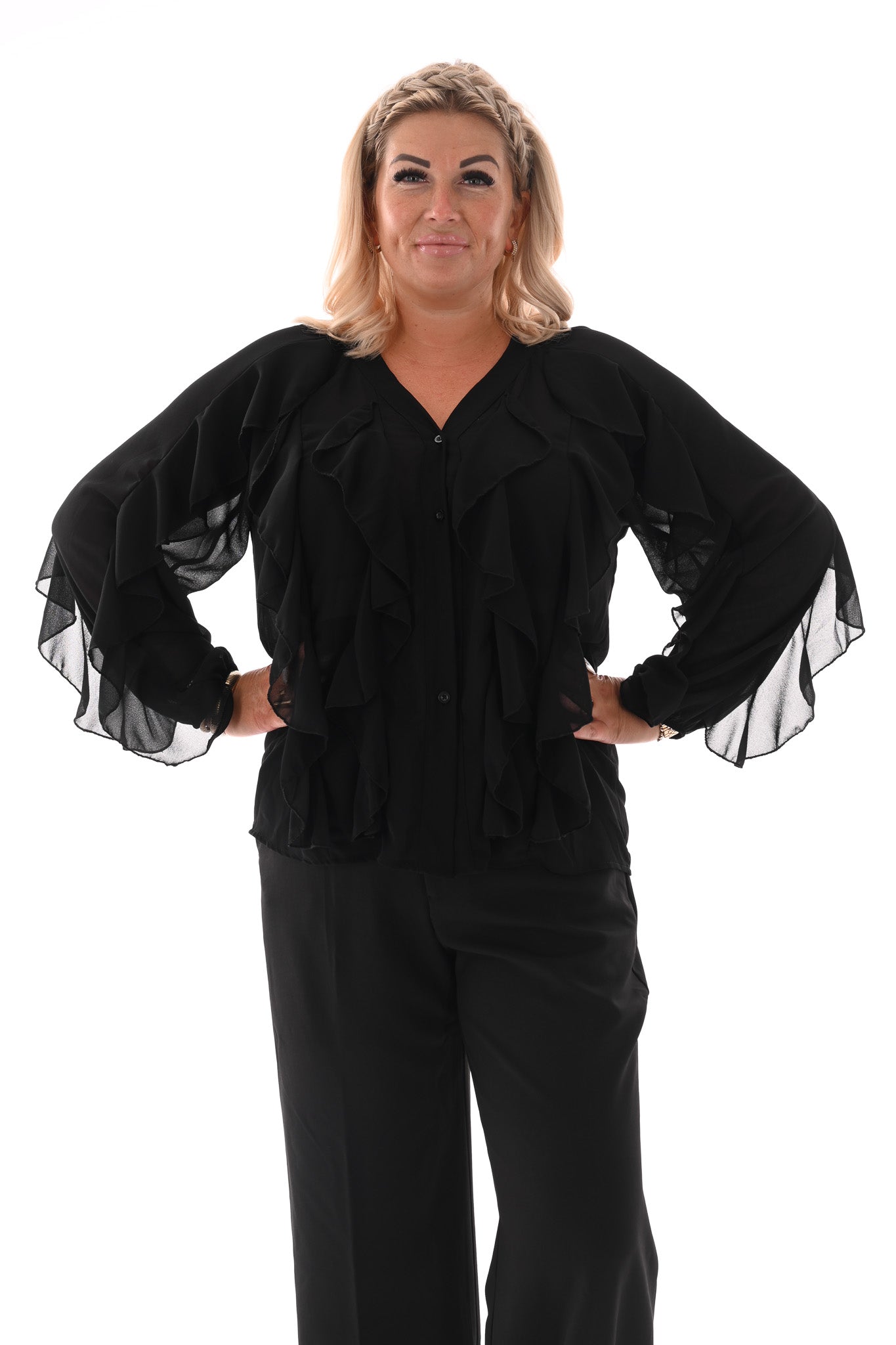 Doorknoop blouse ruffels uni zwart