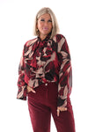 Doorknoop blouse strik roezels abstracte print bordeaux