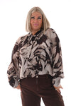 Doorknoop blouse strik roezels abstracte print beige