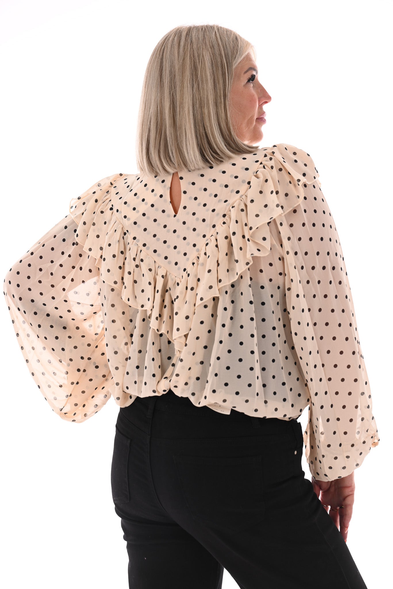 Blouse polka dots met roezel creme