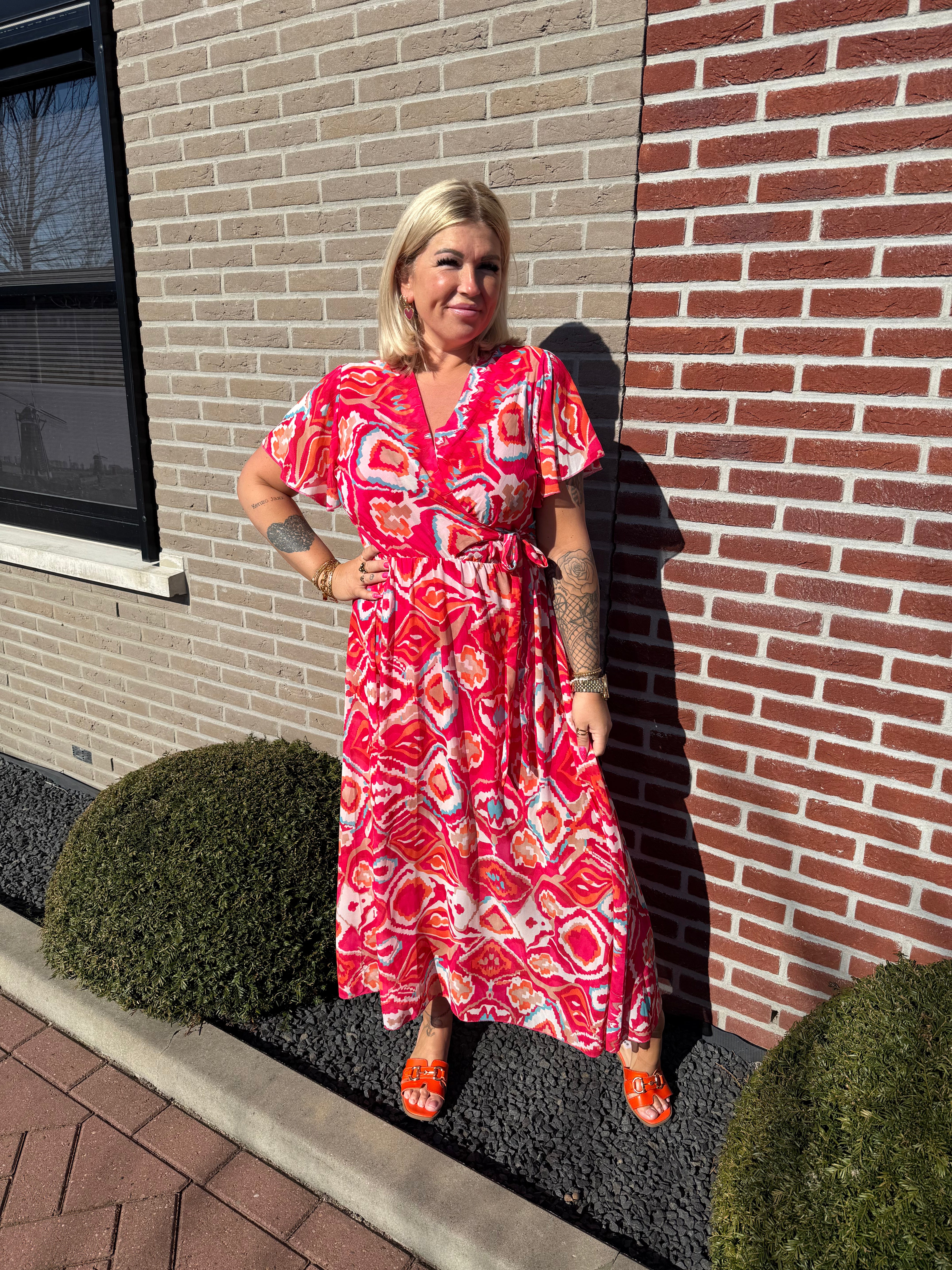 Maxi jurk met strik print wave patroon roze/rood