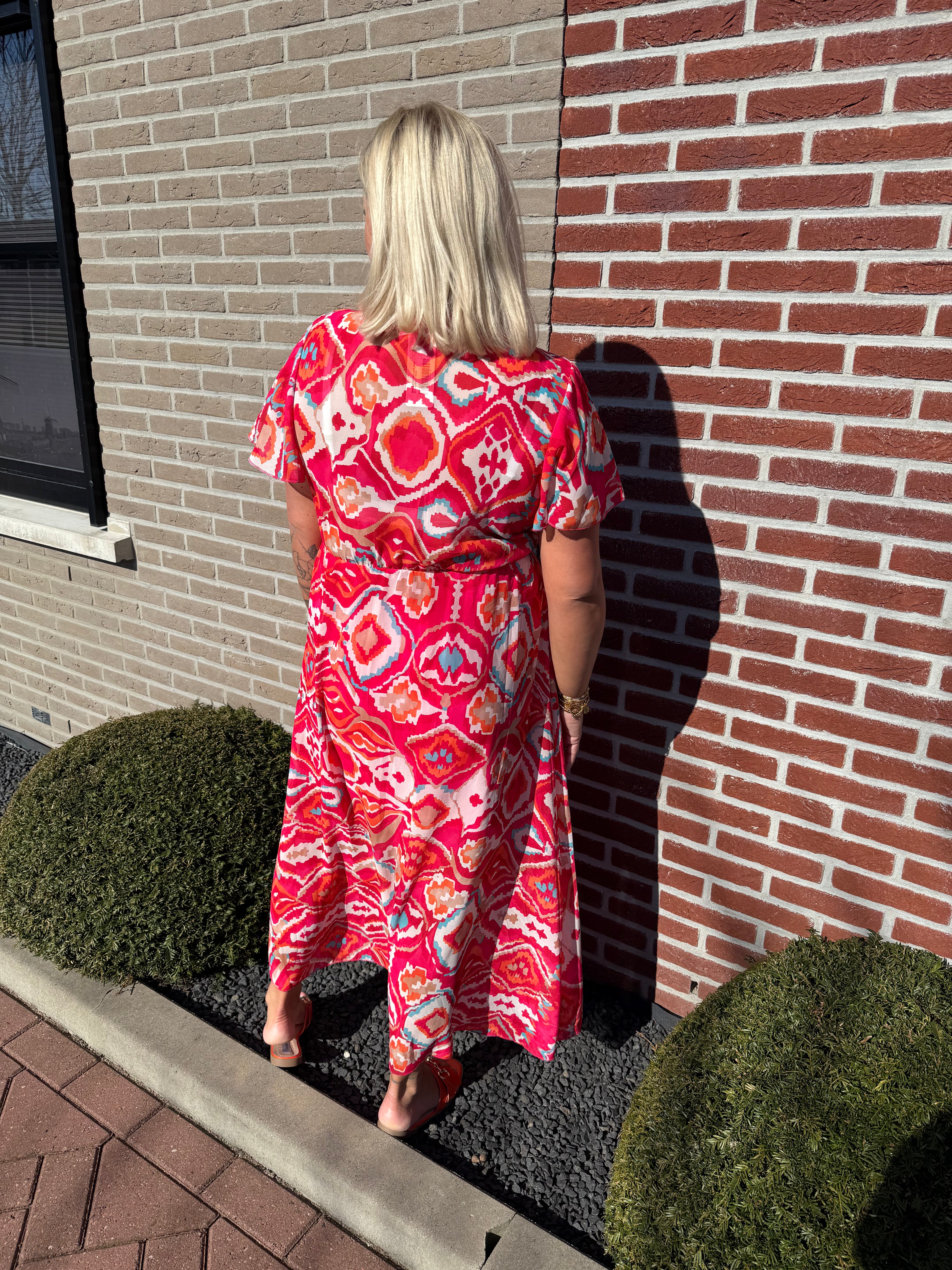 Maxi jurk met strik print wave patroon roze/rood
