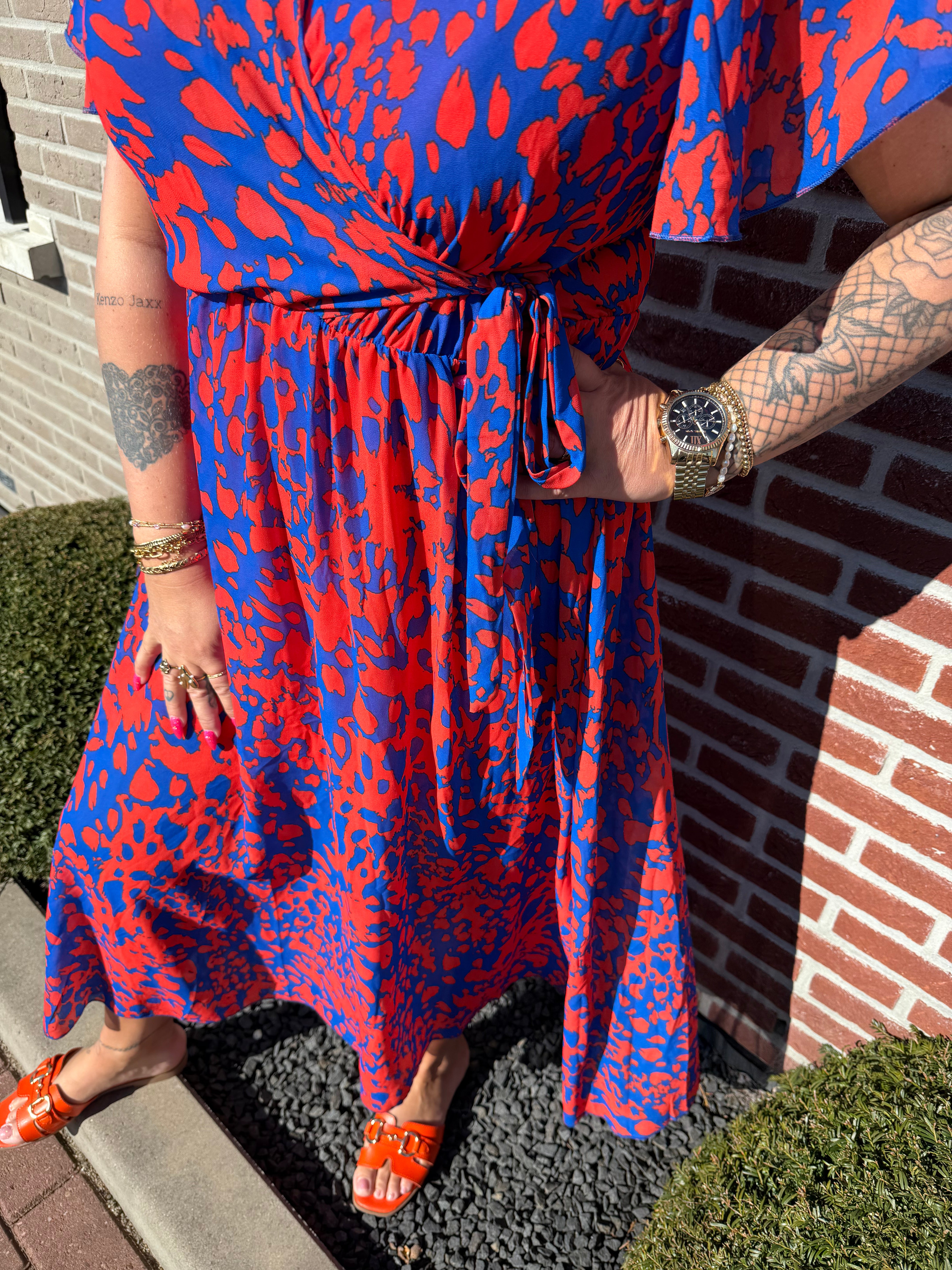 Maxi jurk met strik print gevlekt oranje/blauw