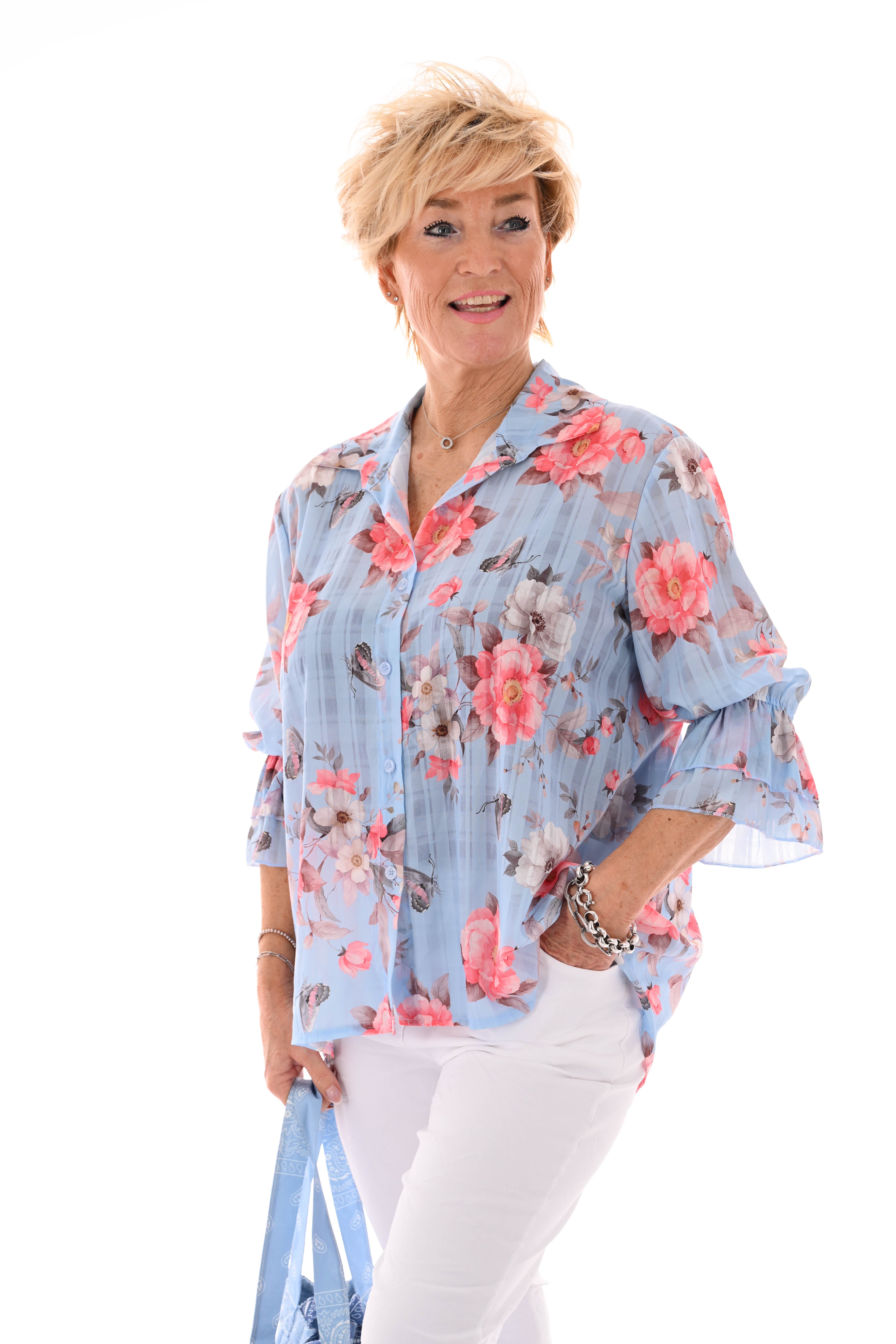 Doorknoop blouse flowers lichtblauw