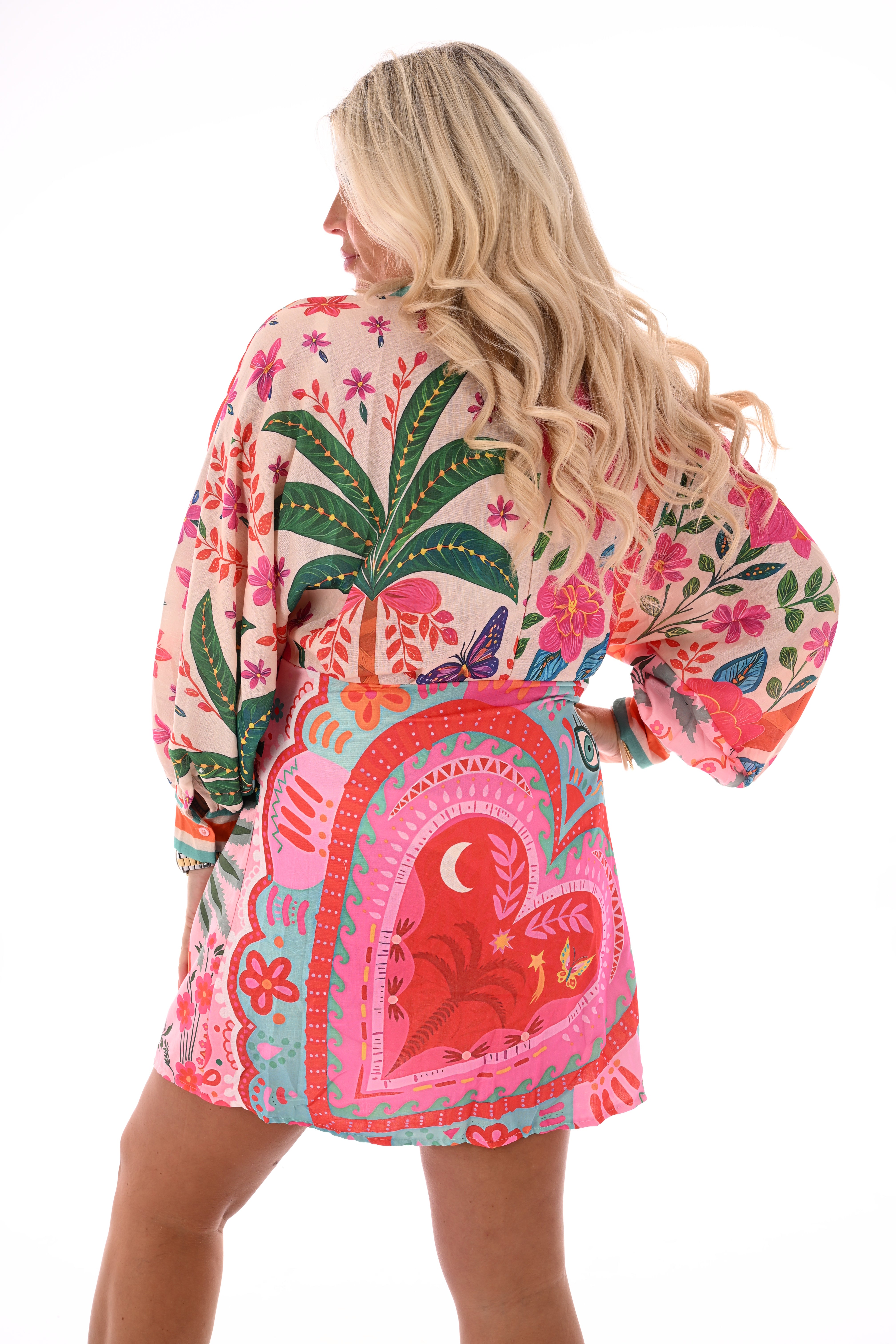 Korte wikkeljurk print bloemen fuchsia