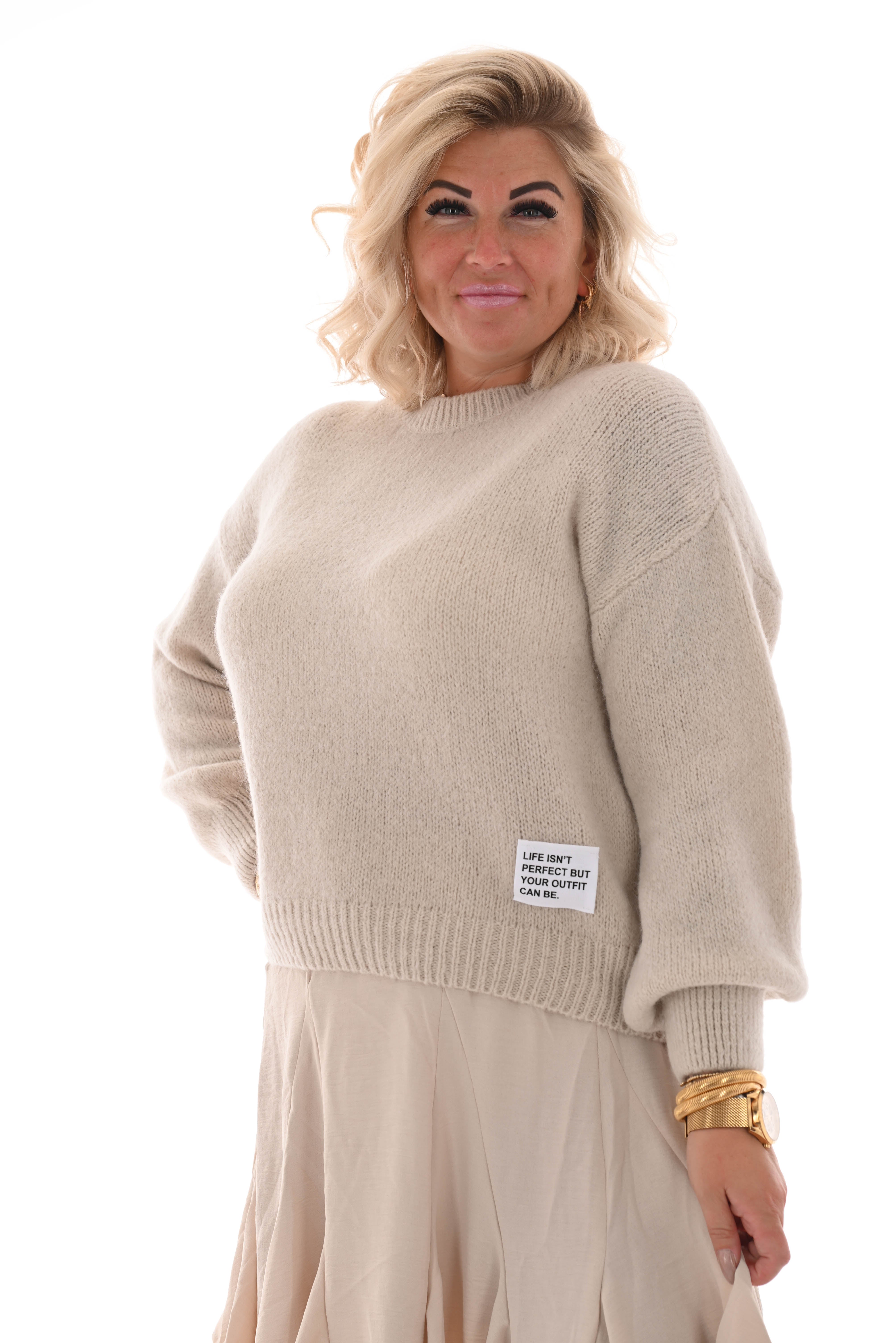 Gebreide trui met applicatie beige