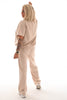 Tweedelig pak korte mouwen ronde hals beige