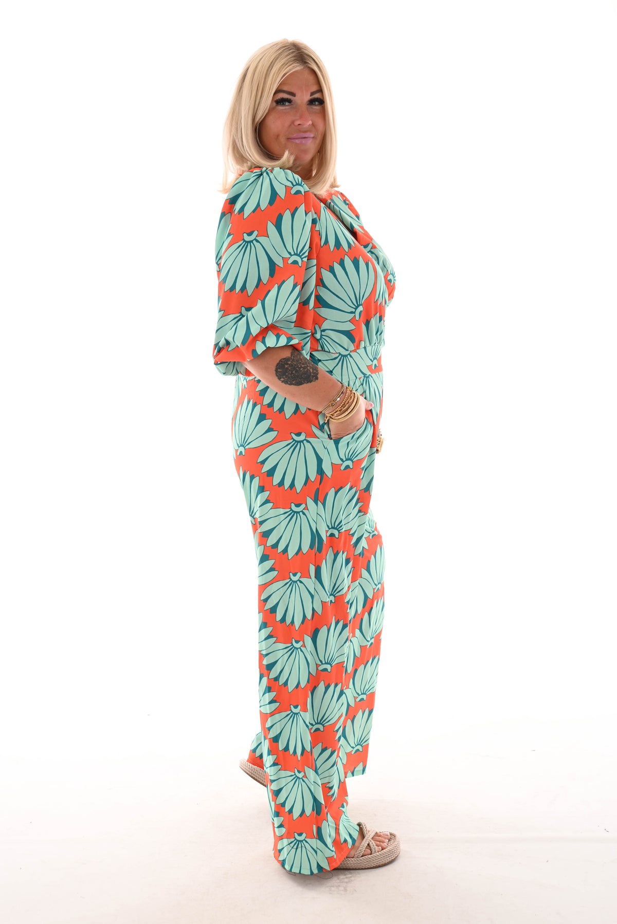 Jumpsuit overslag print bloemen oranje/turquoise