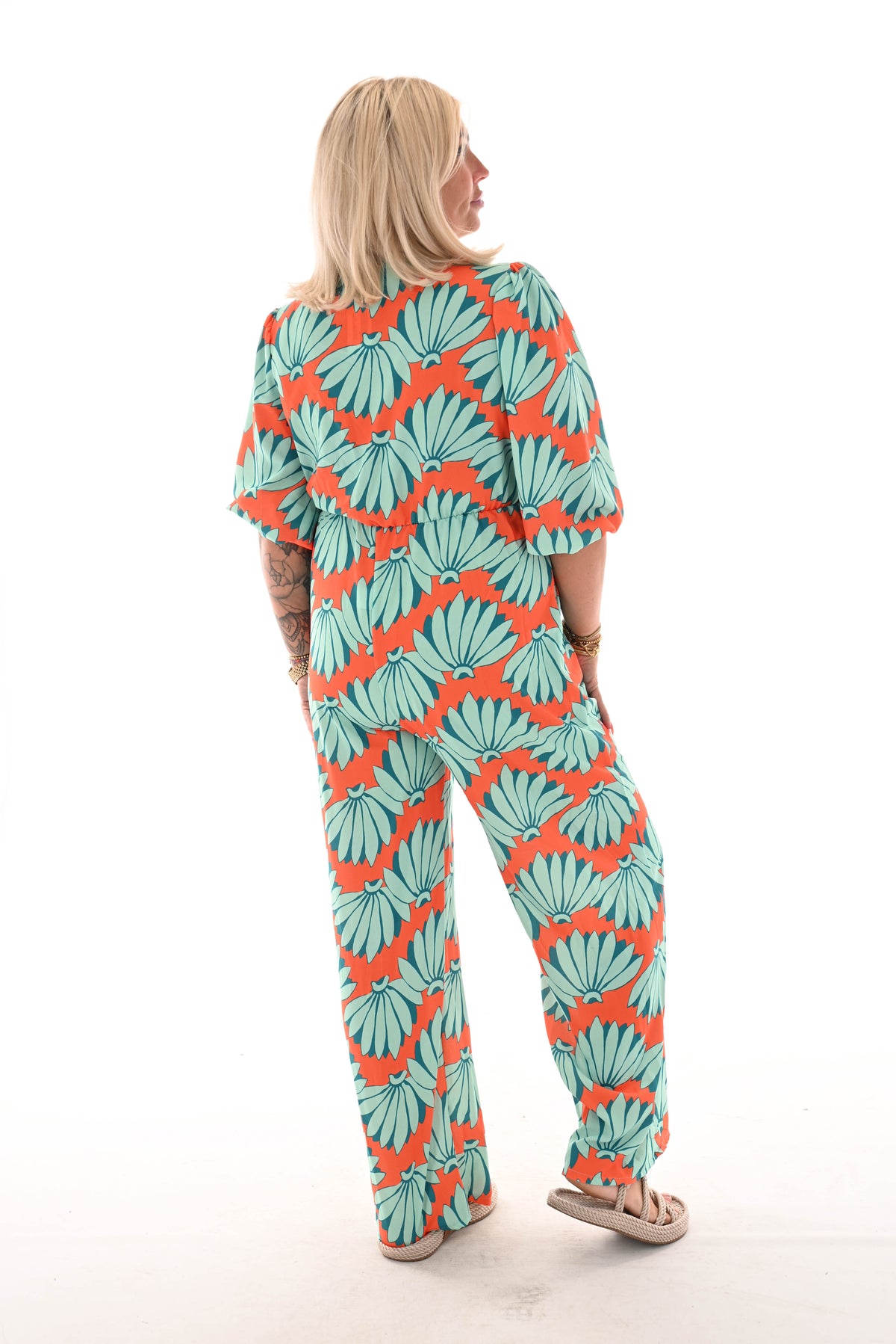 Jumpsuit overslag print bloemen oranje/turquoise