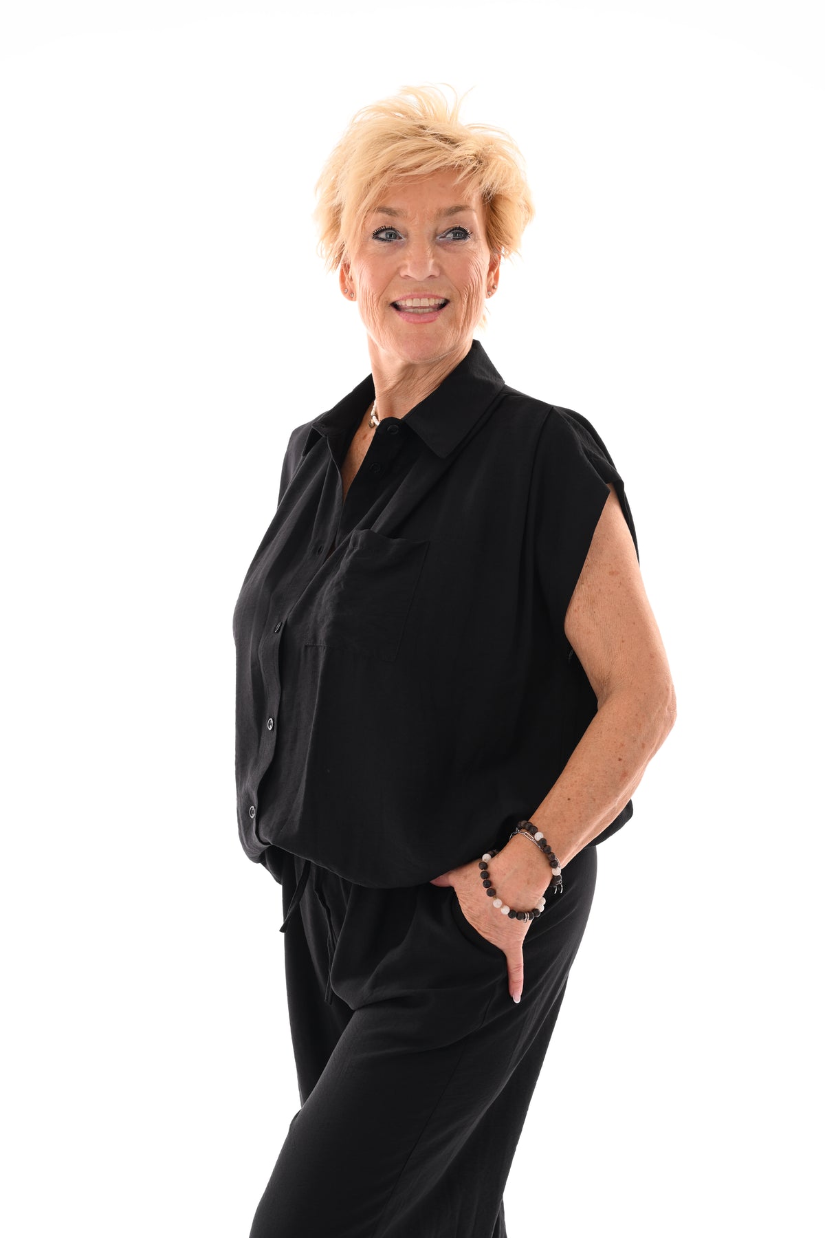 Tweedelig set doorknoop blouse kapmouwen zwart