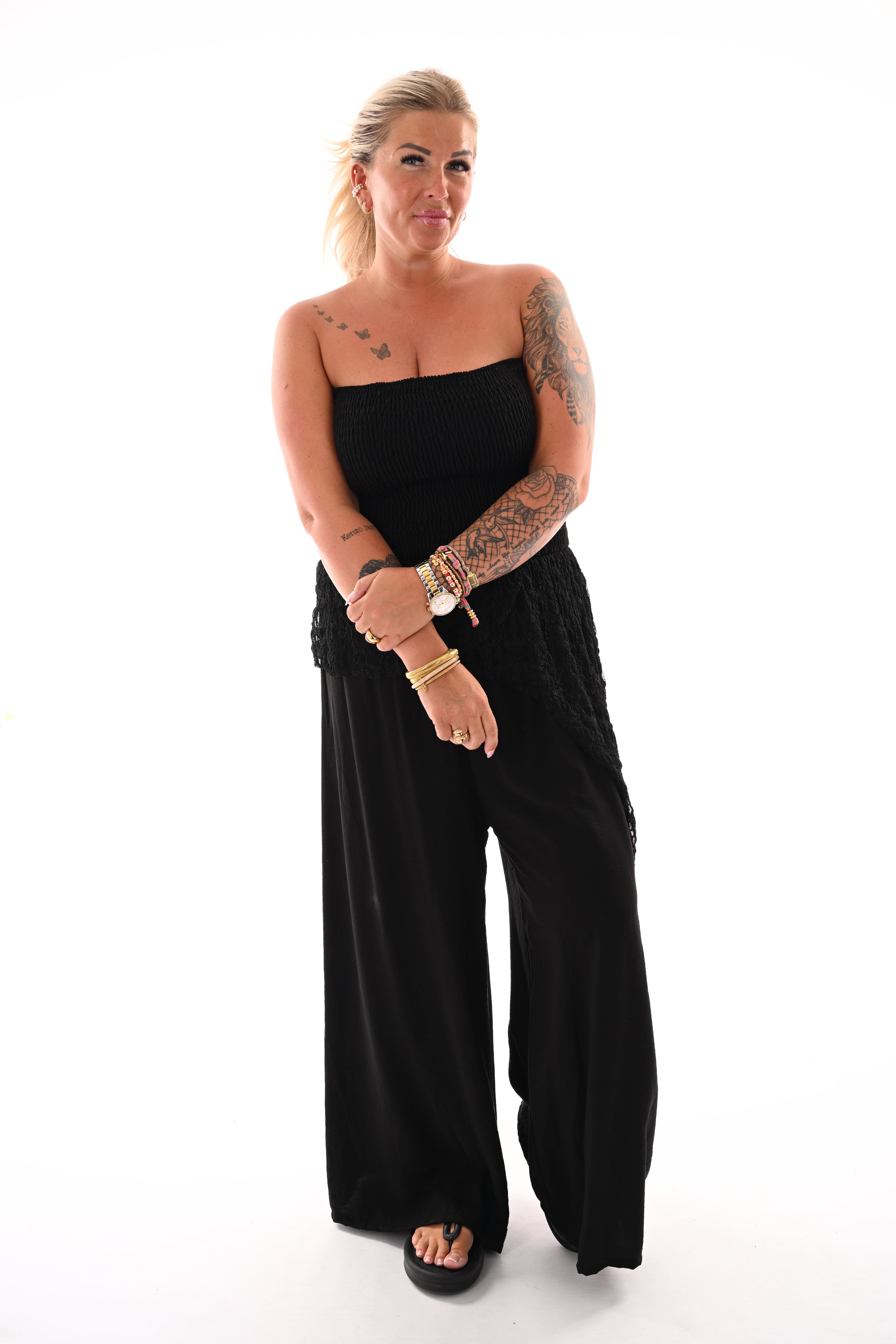 Off-shoulder jumpsuit kanten detail zwart