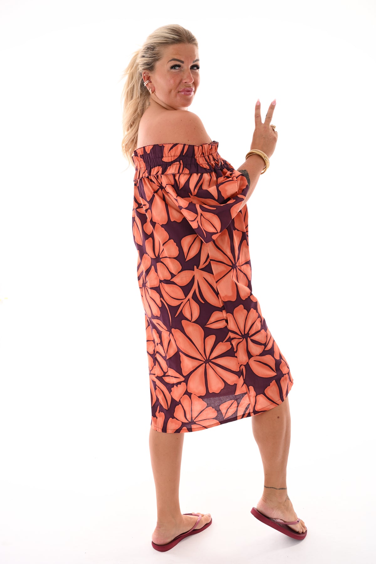 Jurk off-shoulder bladeren aubergine/oranje