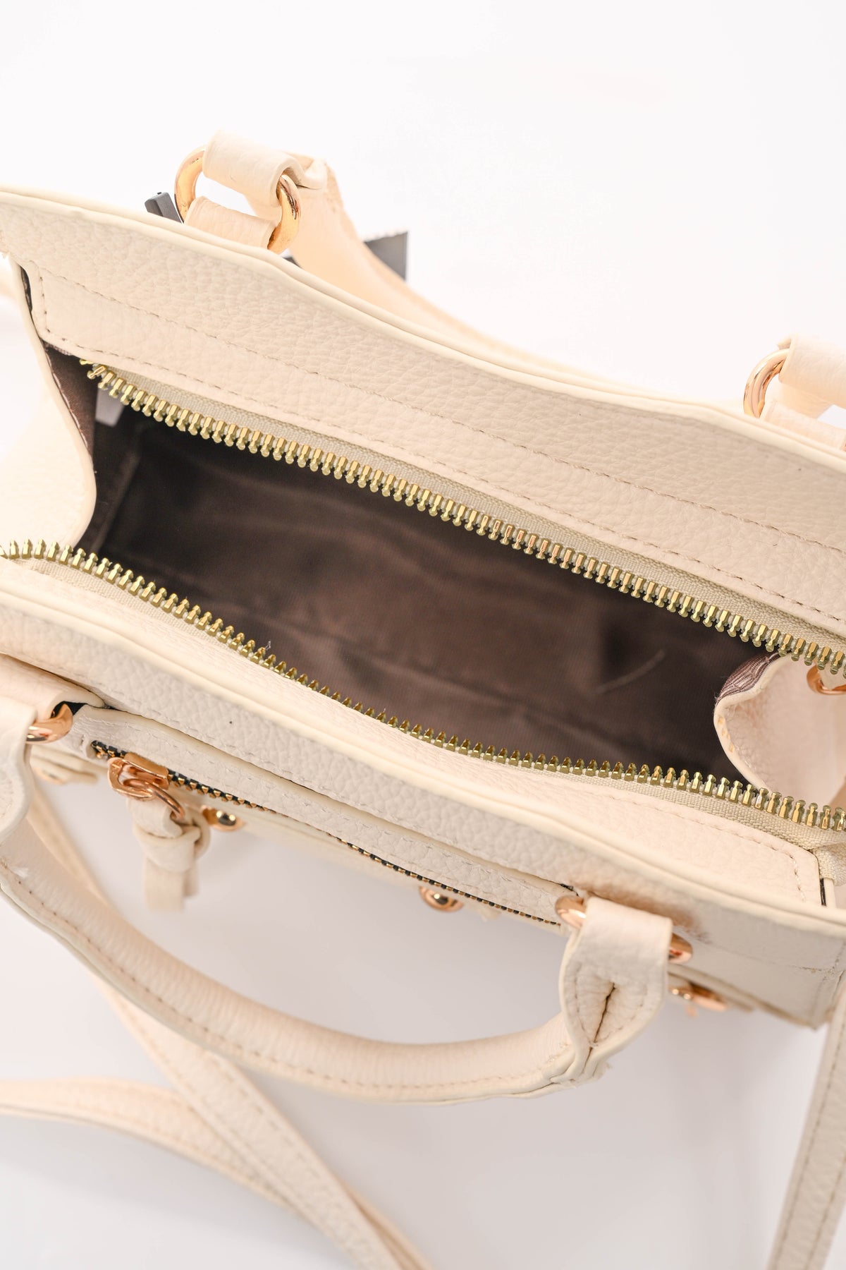 Handtas met studs en gespjes creme