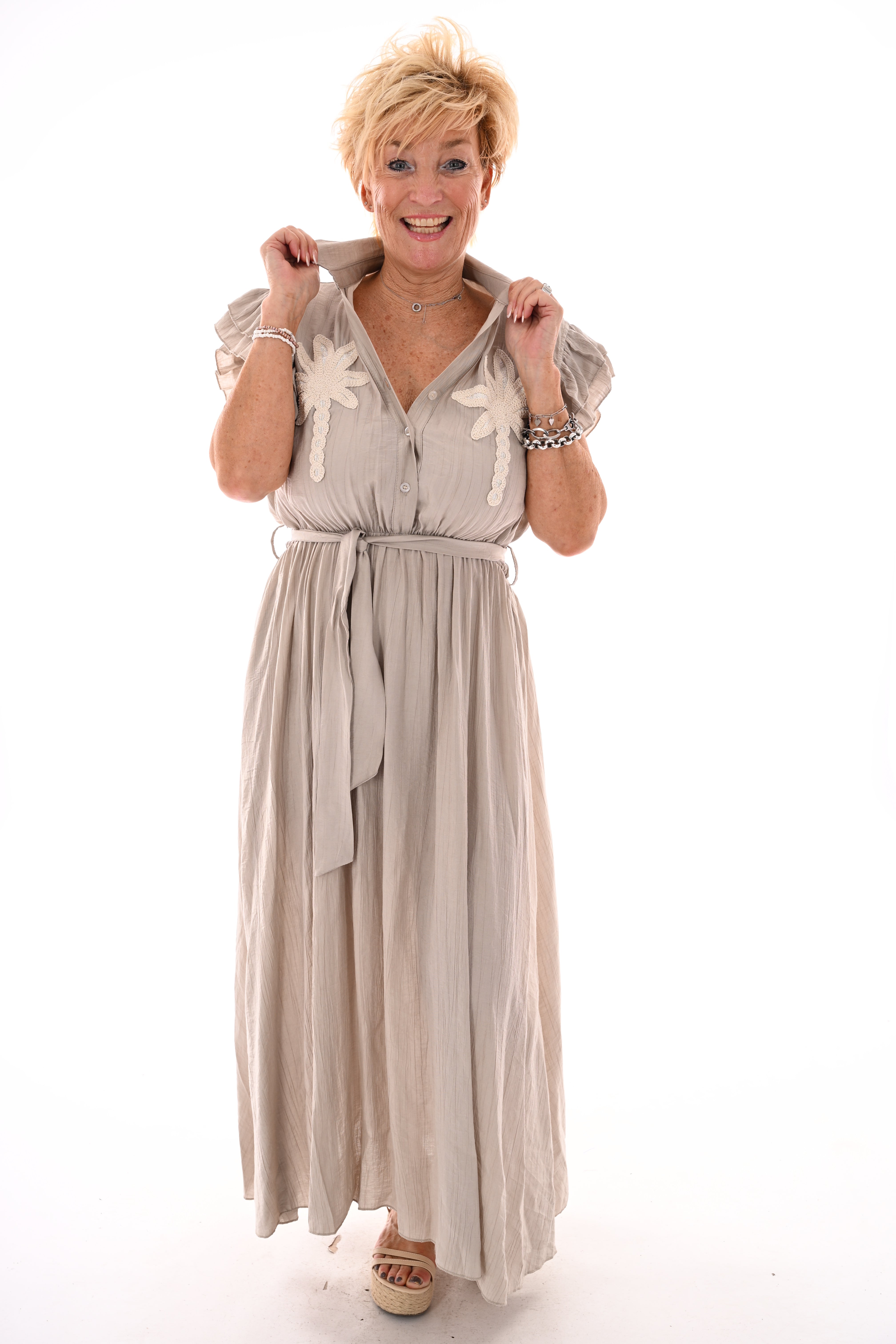 Lange jurk roezels en palms uni taupe