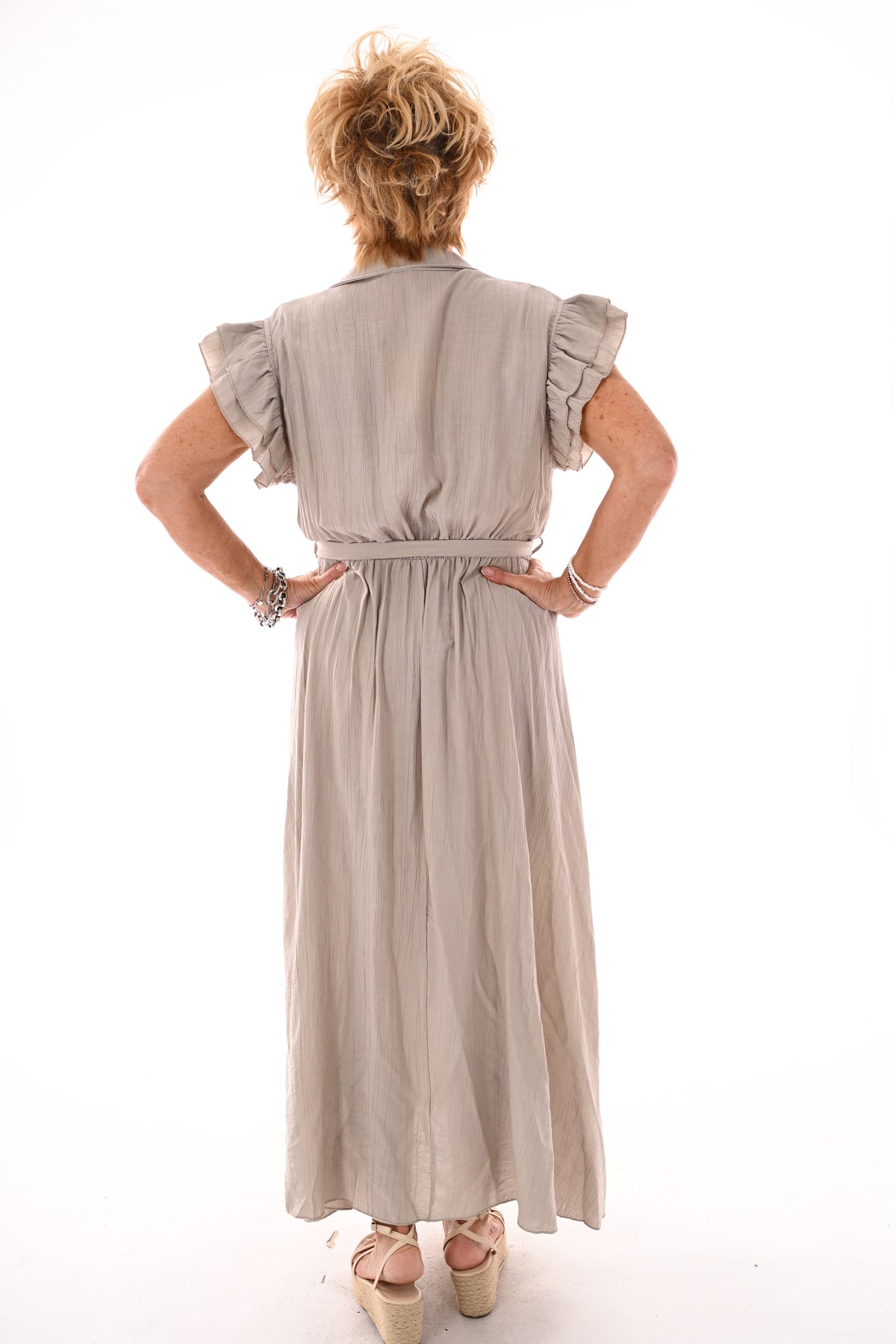 Lange jurk roezels en palms uni taupe