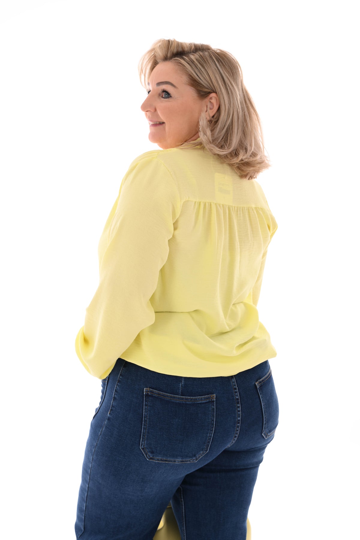 Top lange mouwen met strik lichtgeel
