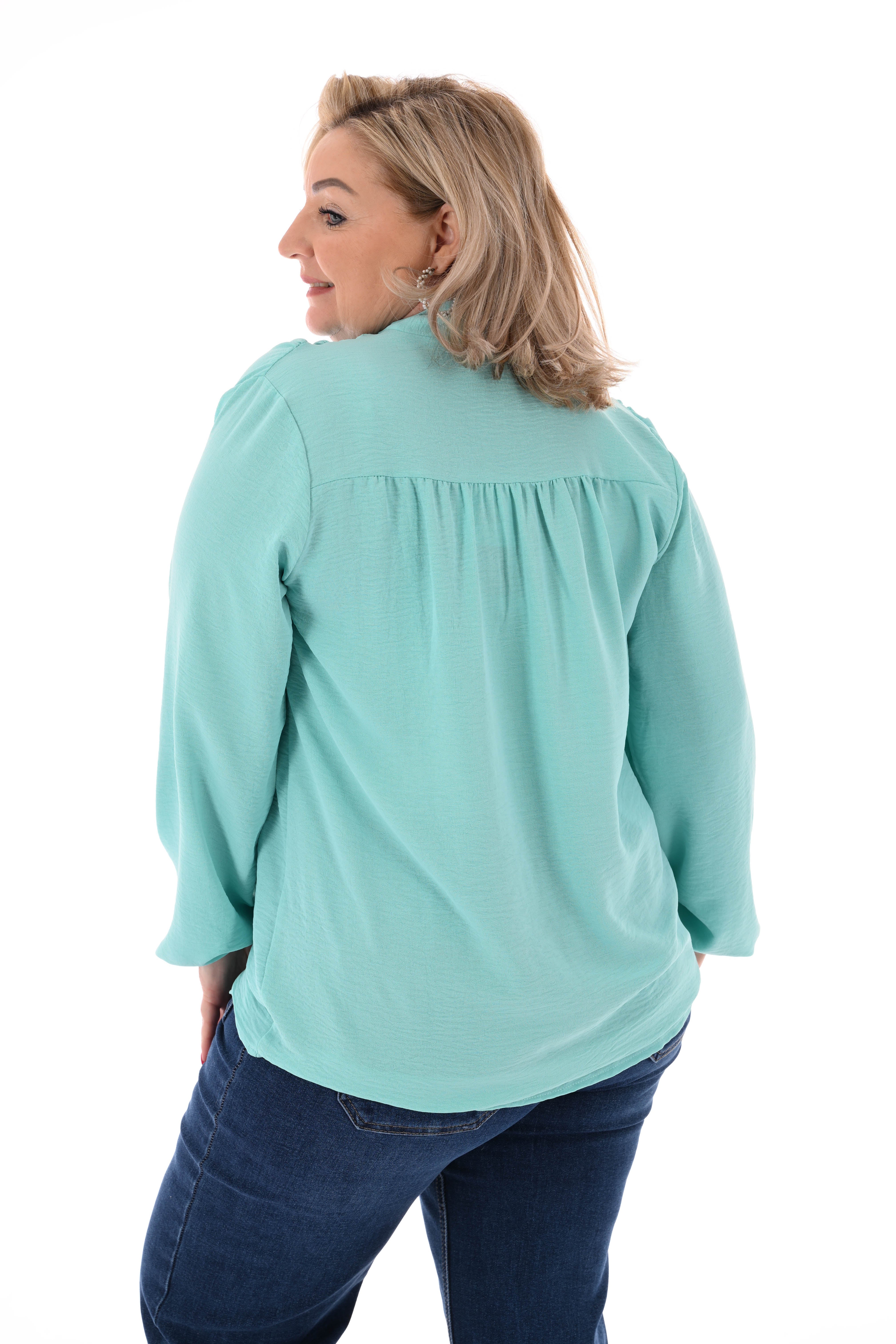 Top lange mouwen met strik turquoise