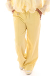 Wijde broek met brede elastieken band botergeel