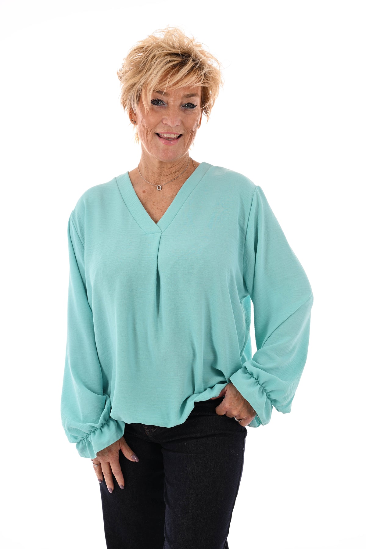 Top trompetmouwen v-hals uni turquoise