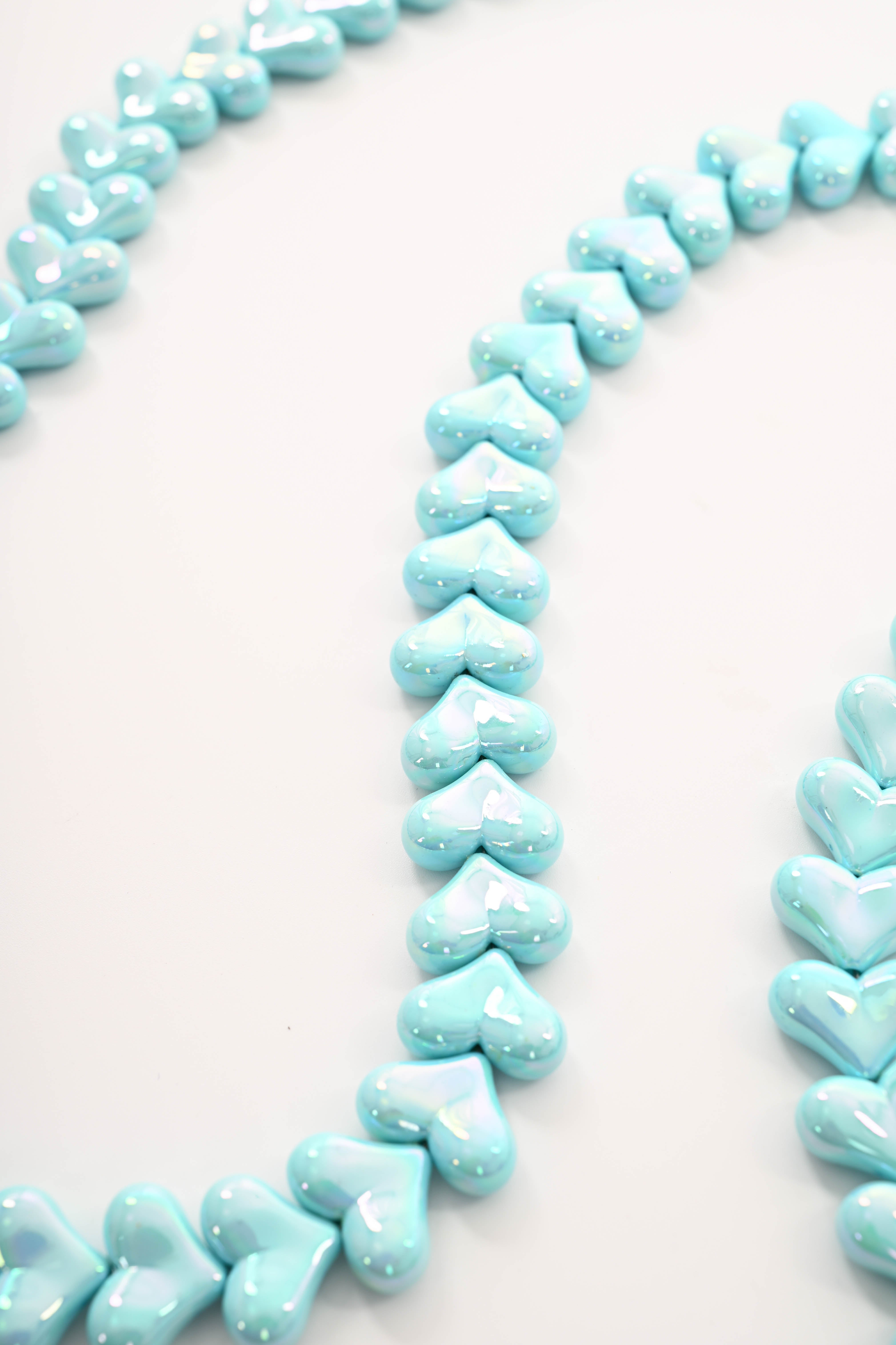 Telefoonkoord lang met hartjes turquoise