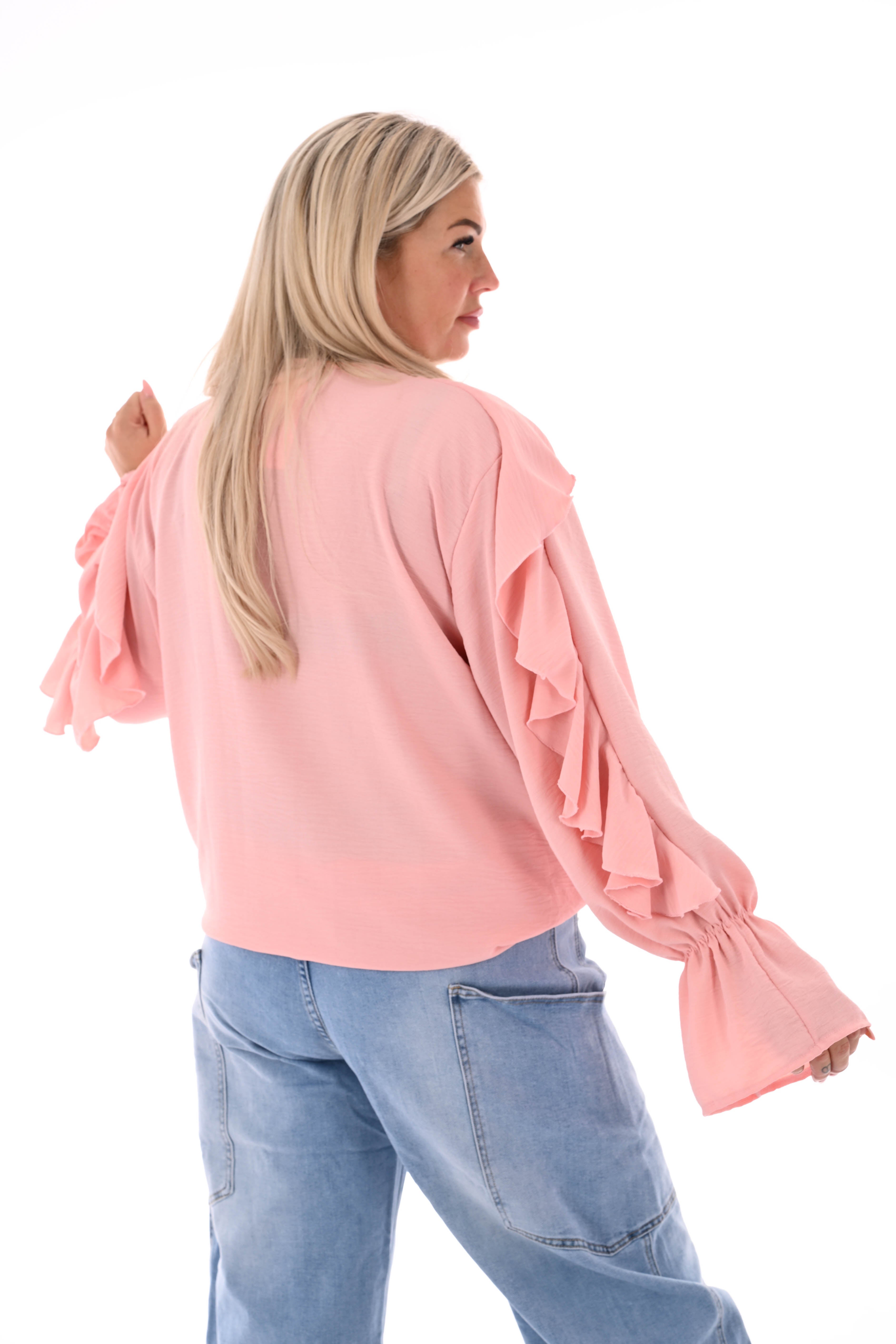 Blouse roezels met trompetmouwen lichtroze