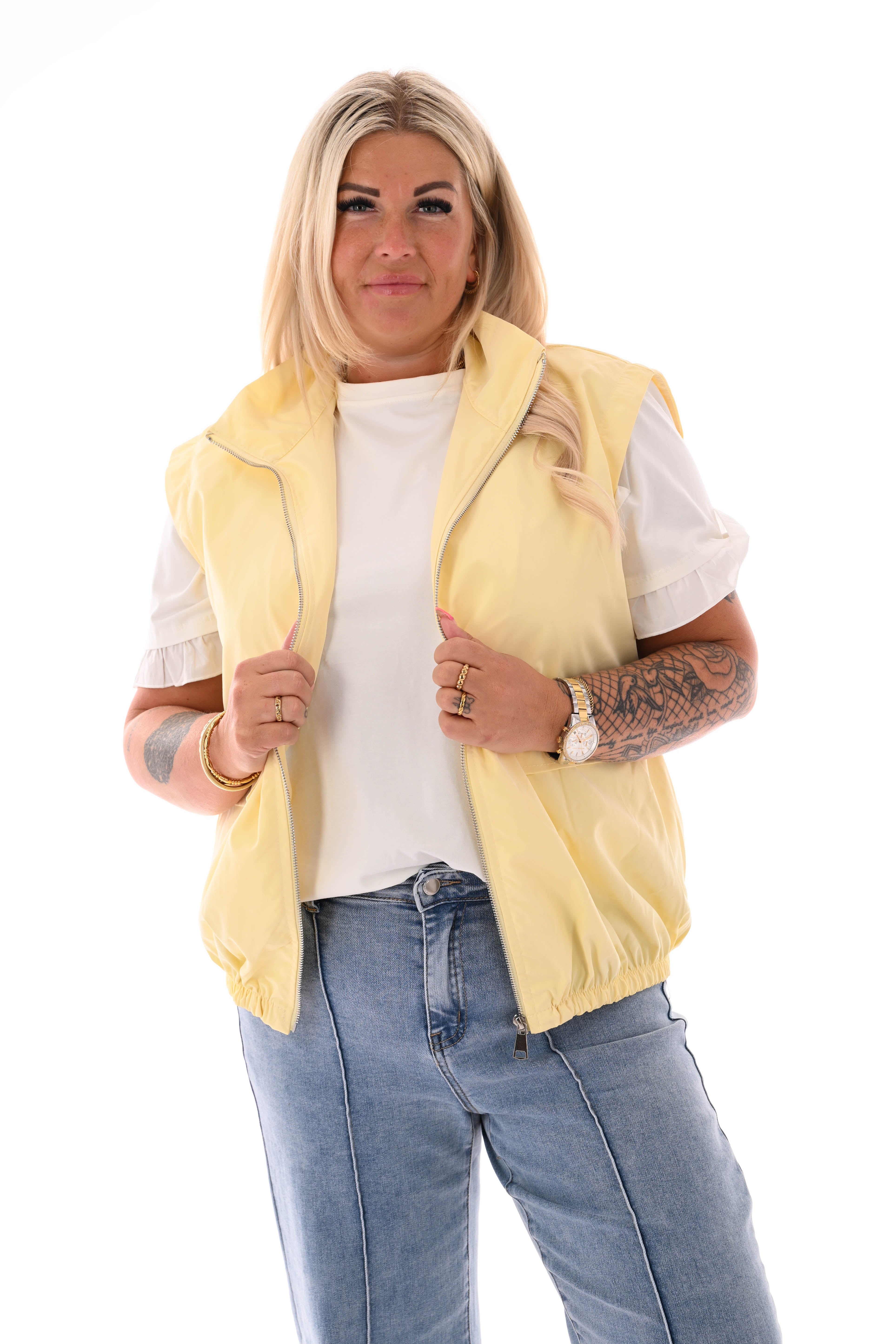 Bodywarmer met rits uni botergeel