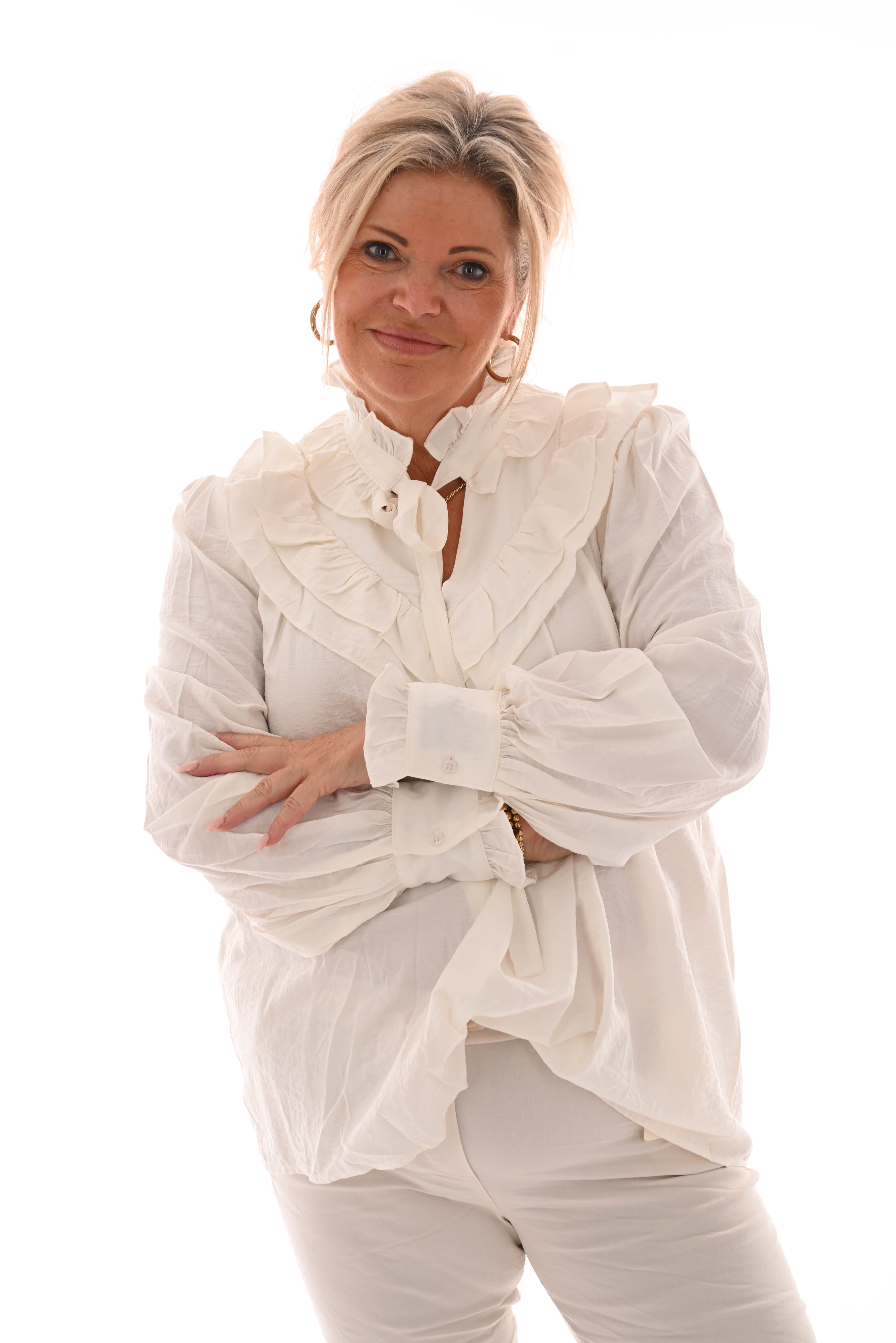 Blouse met strik en roezels roomwit