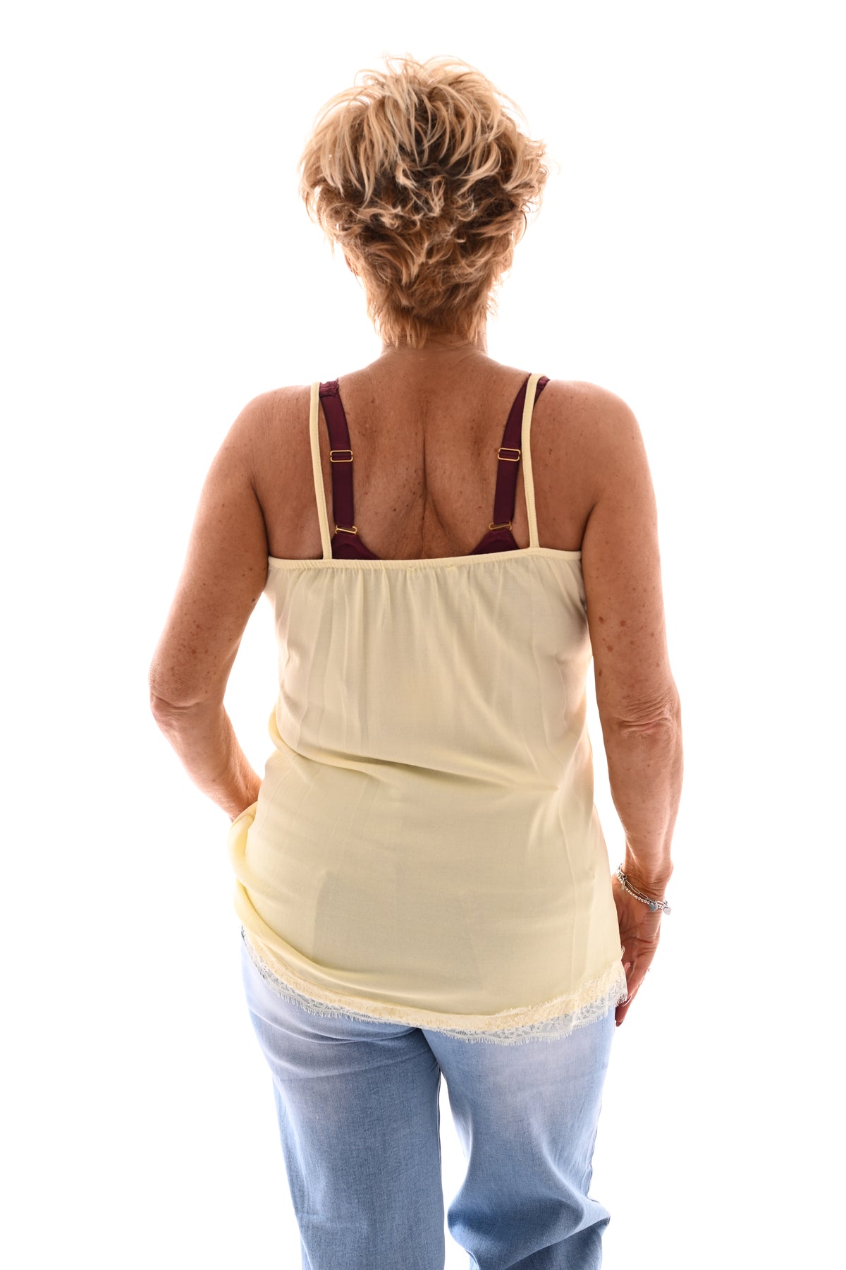 Hemdje met kanten rand lichtgeel