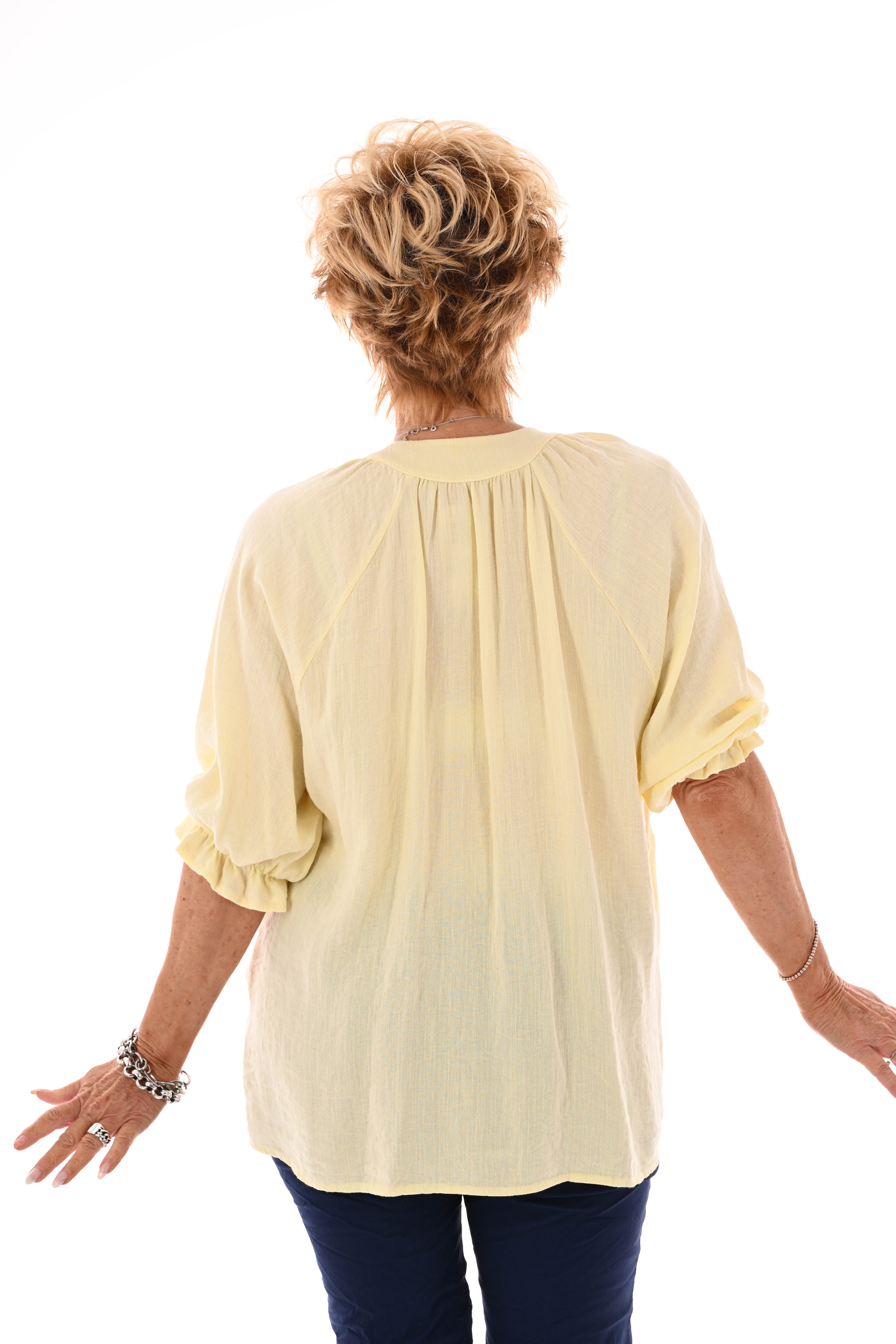 Blouse v-hals korte roezelmouwen lichtgeel