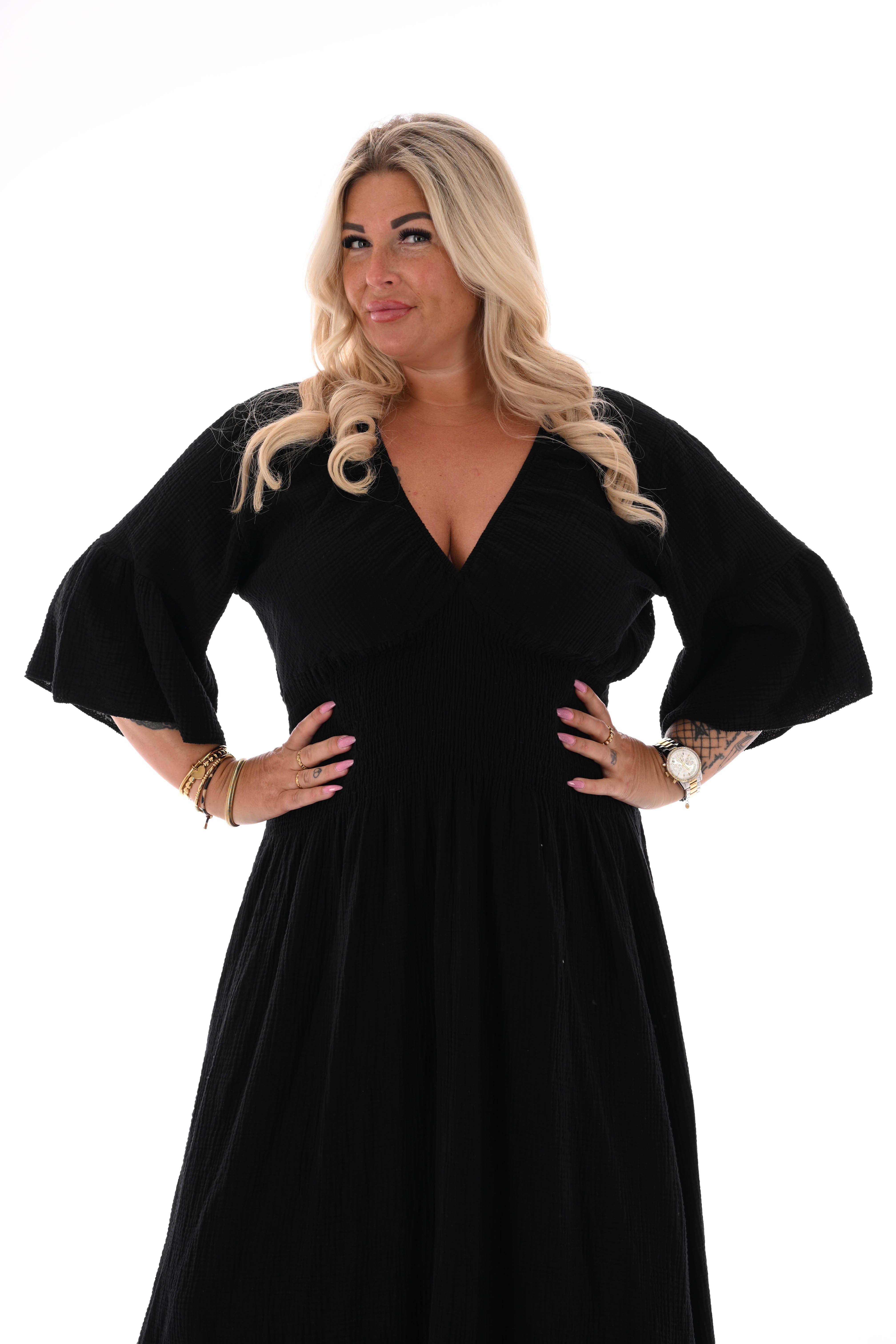 Lange wafeljurk v-hals trompetmouwen zwart