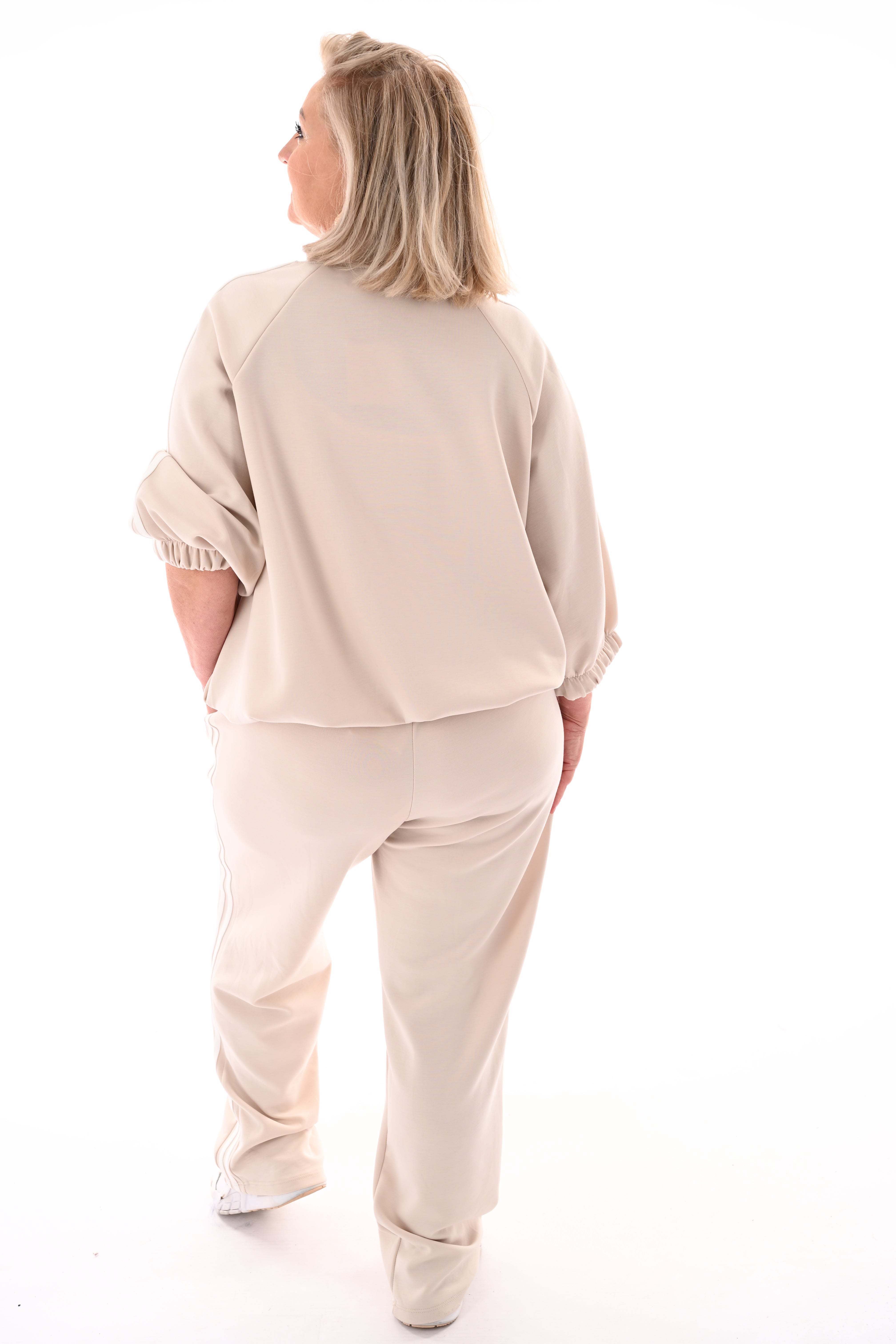 Tweedelig pak met bies beige