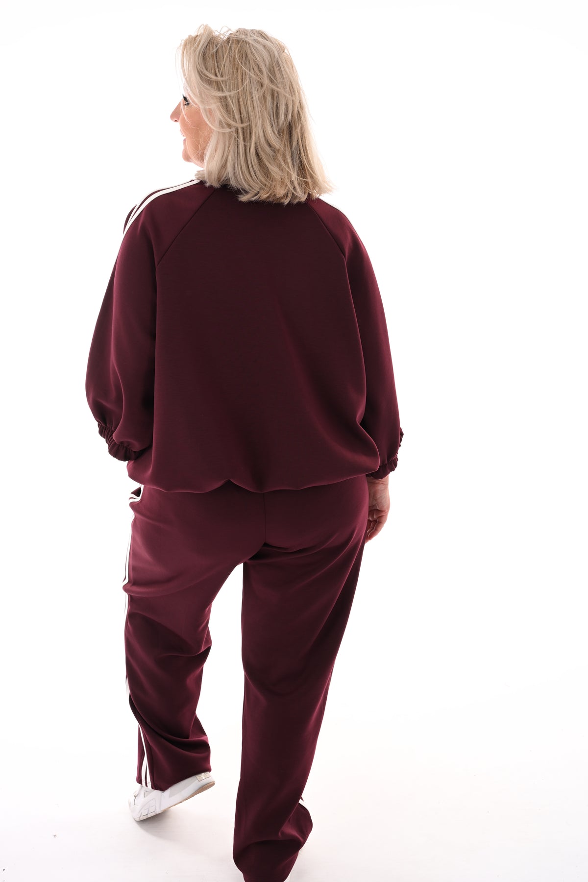 Tweedelig pak met bies bordeaux