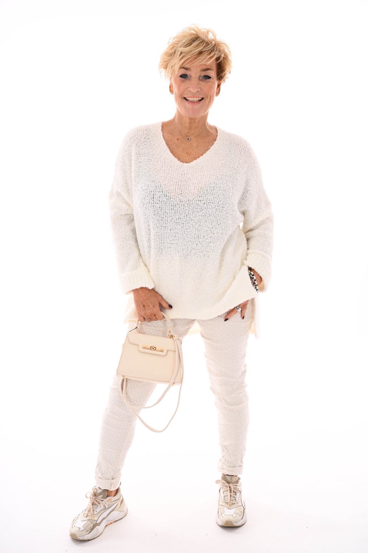 Stretchbroek geometrisch pijlprint creme